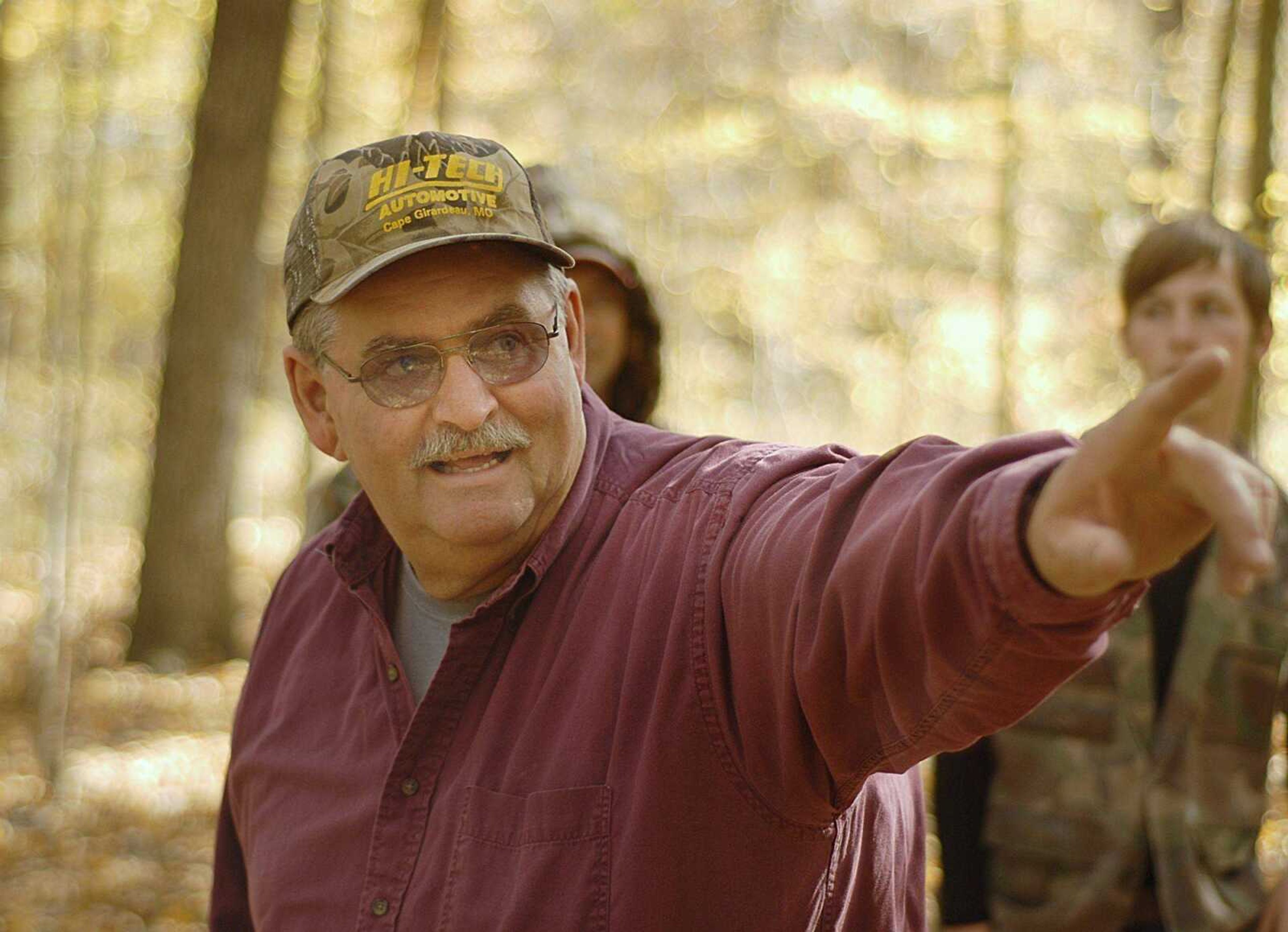 Tom Barrows discussed the best locations to spot deer with three other hunters Friday as they prepared for the next day's hunt on his property near Zalma. (Aaron Eisenhauer)