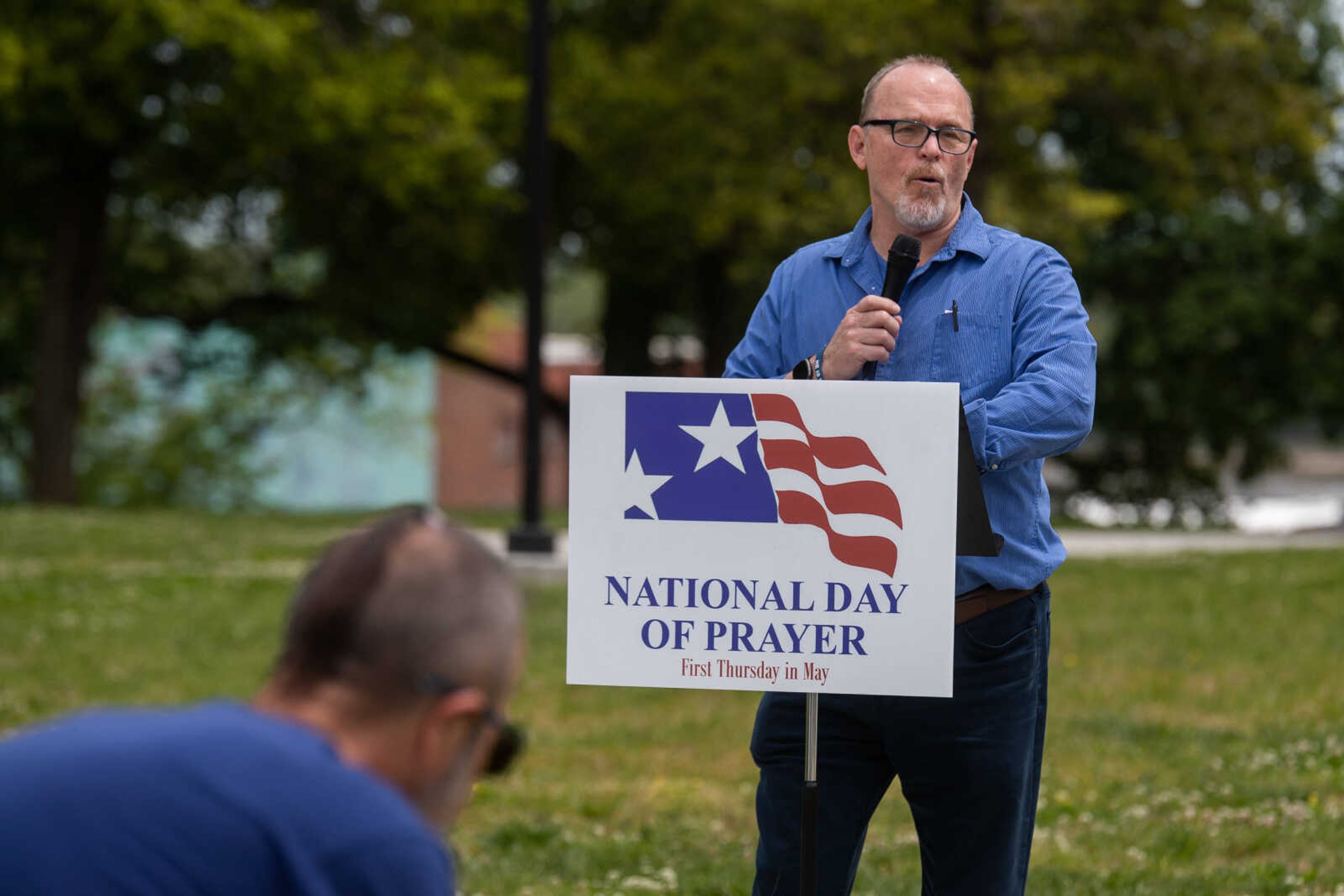 A faith leader prays at the podium during&nbsp;a National Day of Prayer ceremony on Thursday, May 4 at the Cape Girardeau City Hall.