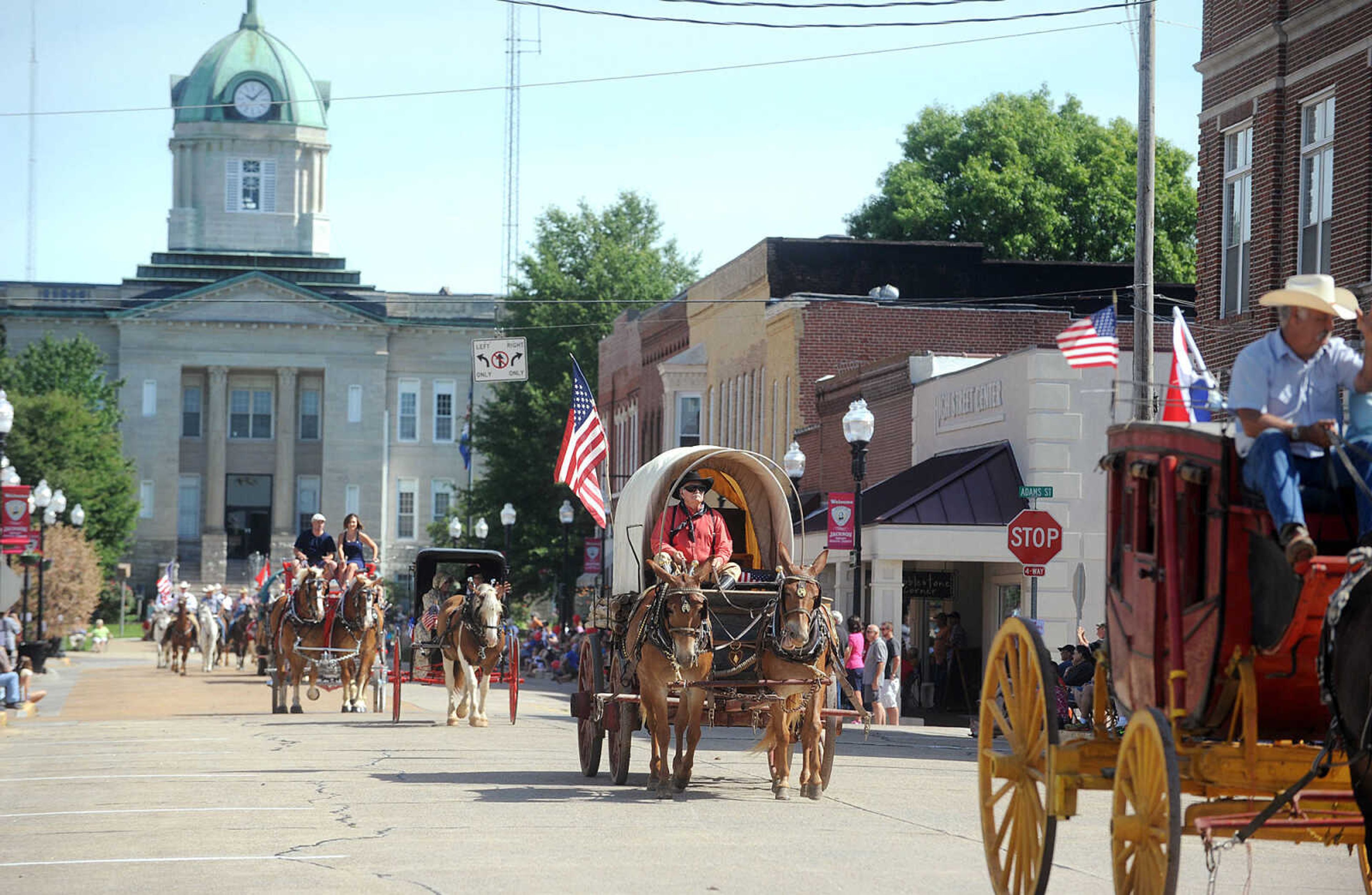 LAURA SIMON ~ lsimon@semissourian.com


People line the sidewalks as old-time horse drawn carriages head down High Street in Jackson, Saturday, July 5, 2014, during the Bicentennial Wagon Trail Parade.