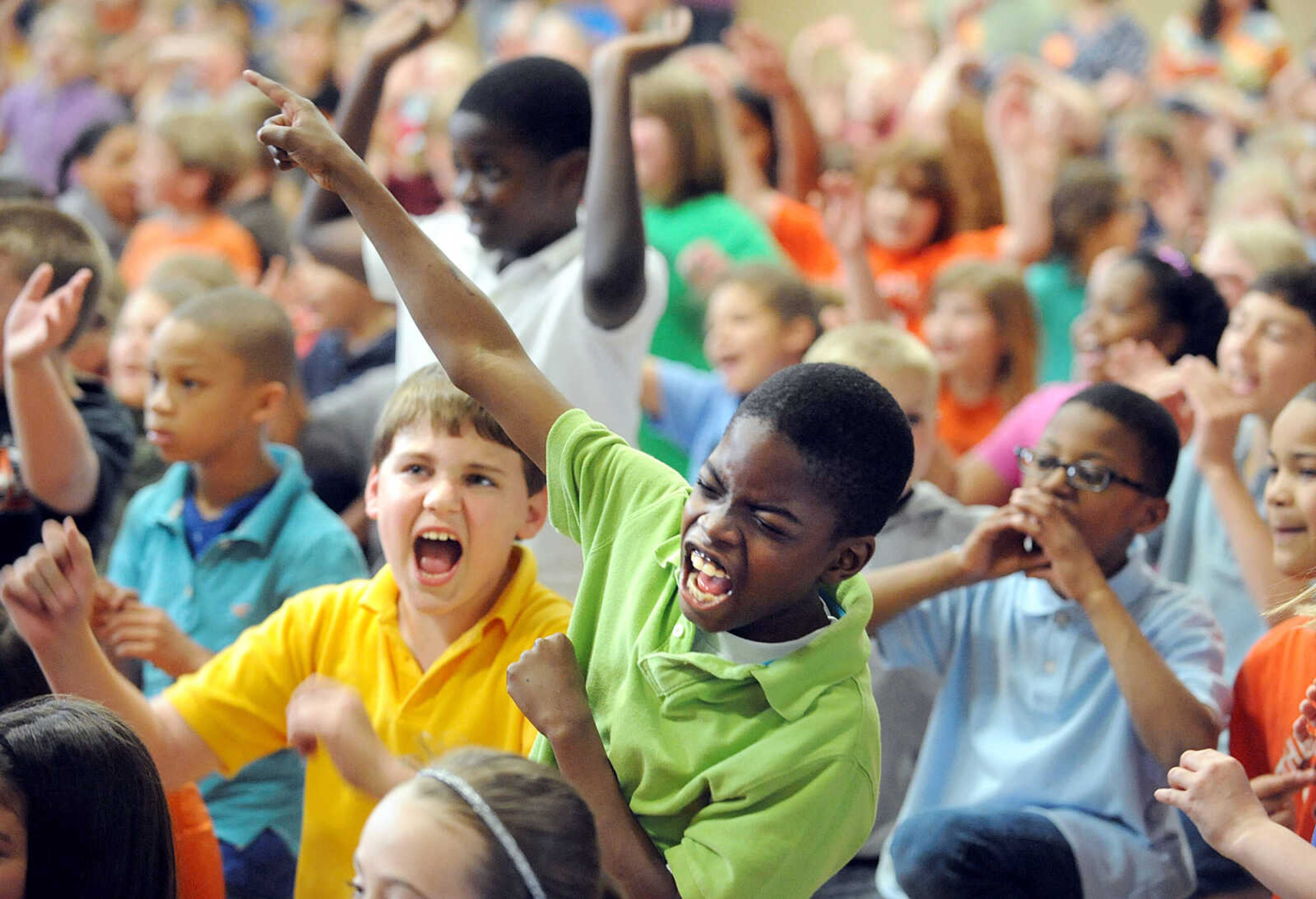 LAURA SIMON ~ lsimon@semissourian.com

Alma Schrader Elementary fourth-grade students Brendan Beasley, left, and Sabian Alford cheer with the rest of the student body during Monday's pep rally to get students motivated for MAP testing. Rowdy the Redhawk, the Cape Public Schools Tiger and members of the Southeast Missouri State football team attended the pep rally. Alma Schrader's MAP testing runs April 16 - April 25.