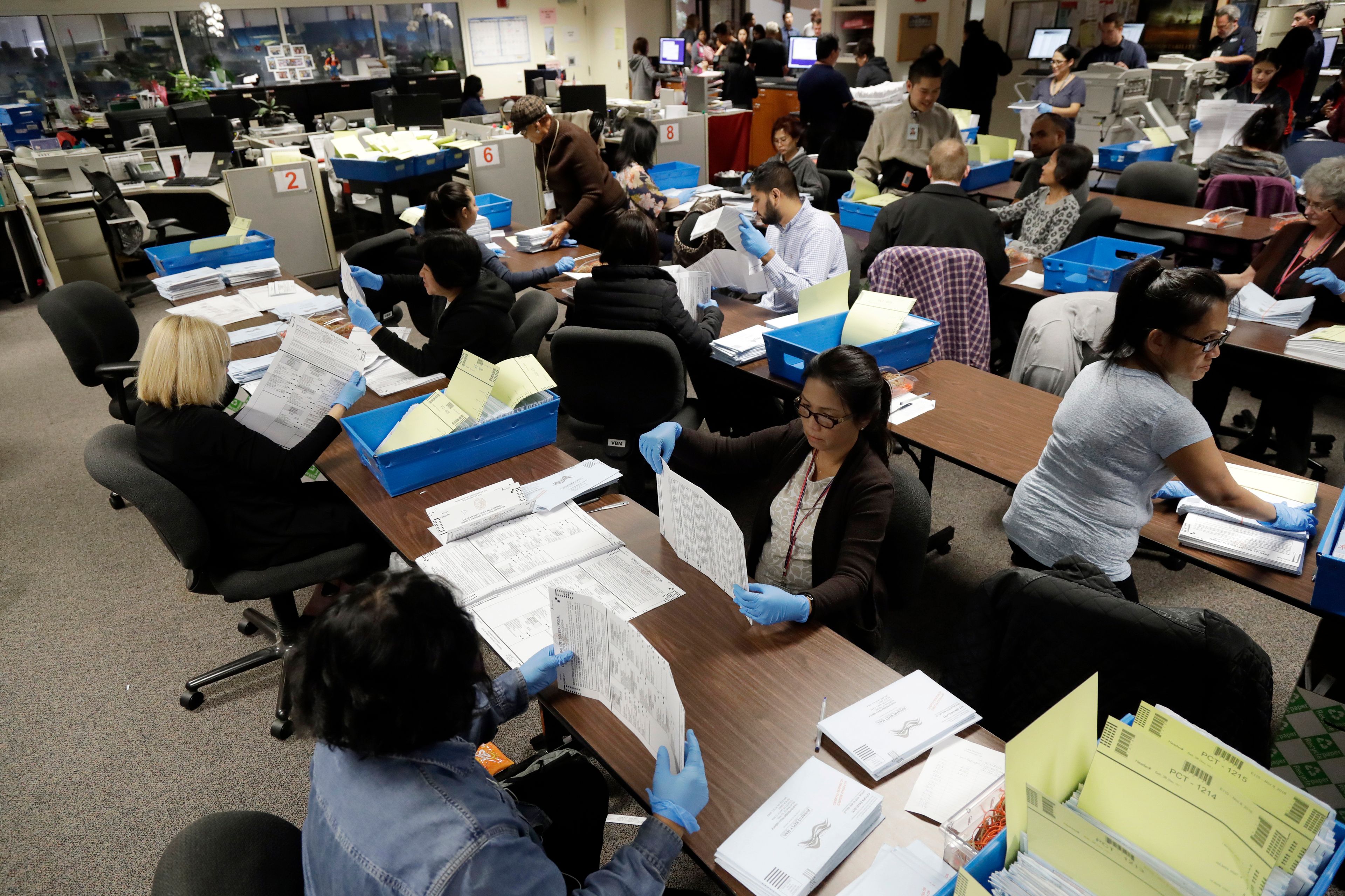 FILE - This Nov. 4, 2016, file photo shows mail-in ballots being sorted at the Santa Clara County Registrar of Voters in San Jose, Calif. (AP Photo/Marcio Jose Sanchez, File)