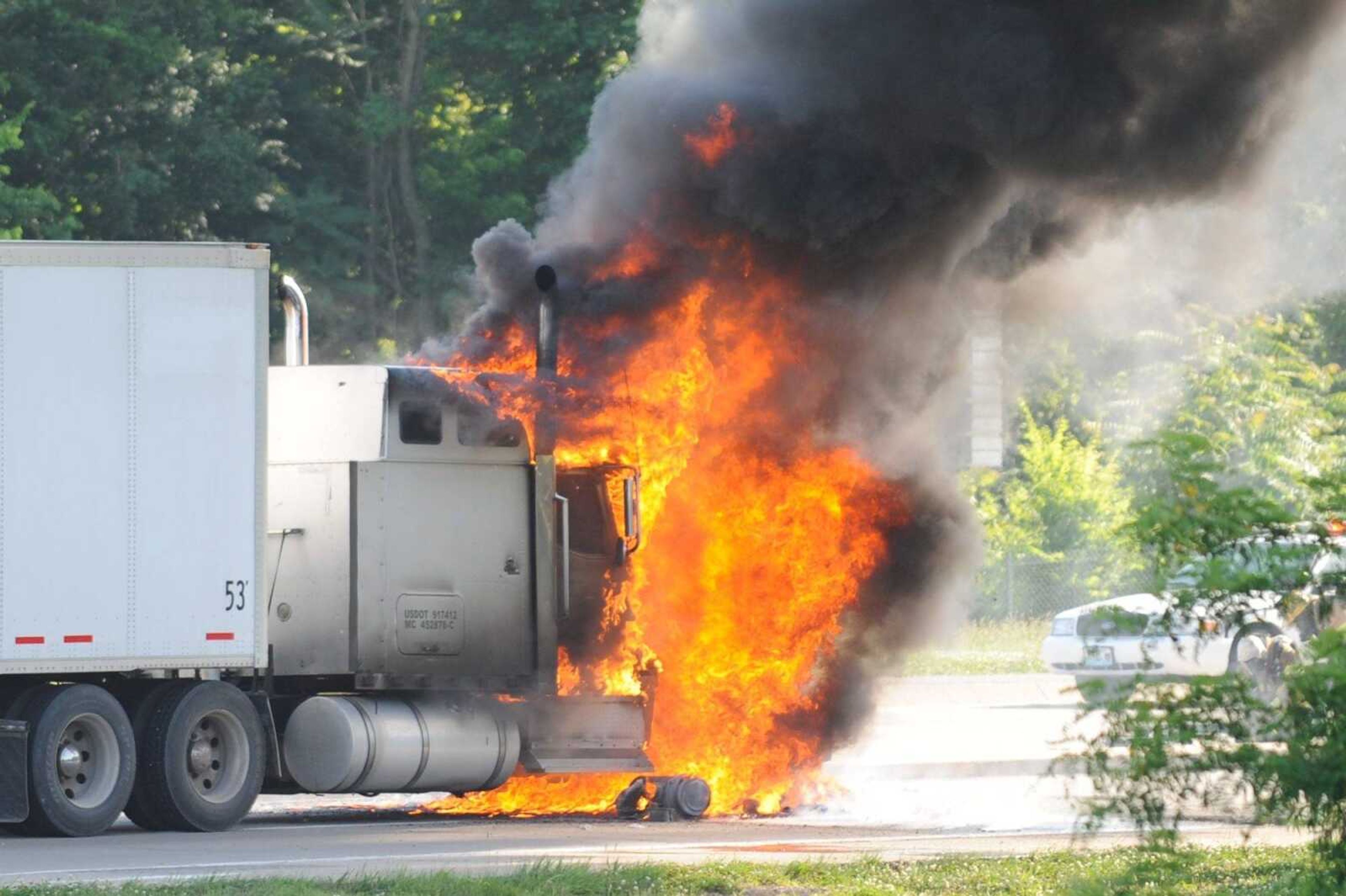 A tractor trailer is engulfed with flames Wednesday evening just west of the Bill Emerson Memorial Bridge on Shawnee Parkway. (Glenn Landberg)