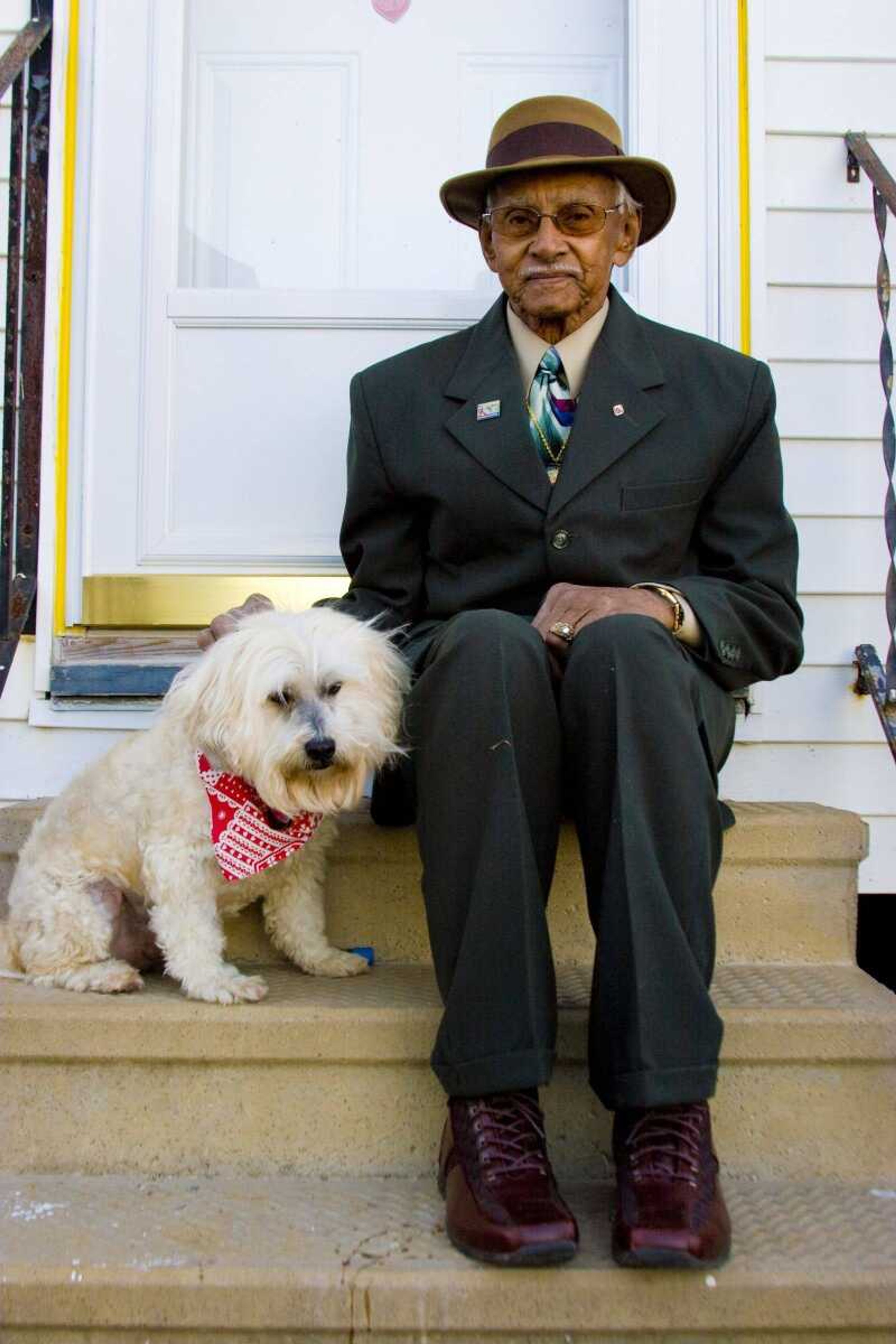 This photo released by Spoken Media shows Malvin Cavalier and his faithful companion, Bandit who are featured in "Mine" a documentary about the essential bond between humans and animals, set against the backdrop of one of the worst natural disasters in modern U.S. history: Hurricane Katrina. (AP Photo/Spoken Media, Zack Smith)**NO SALES**