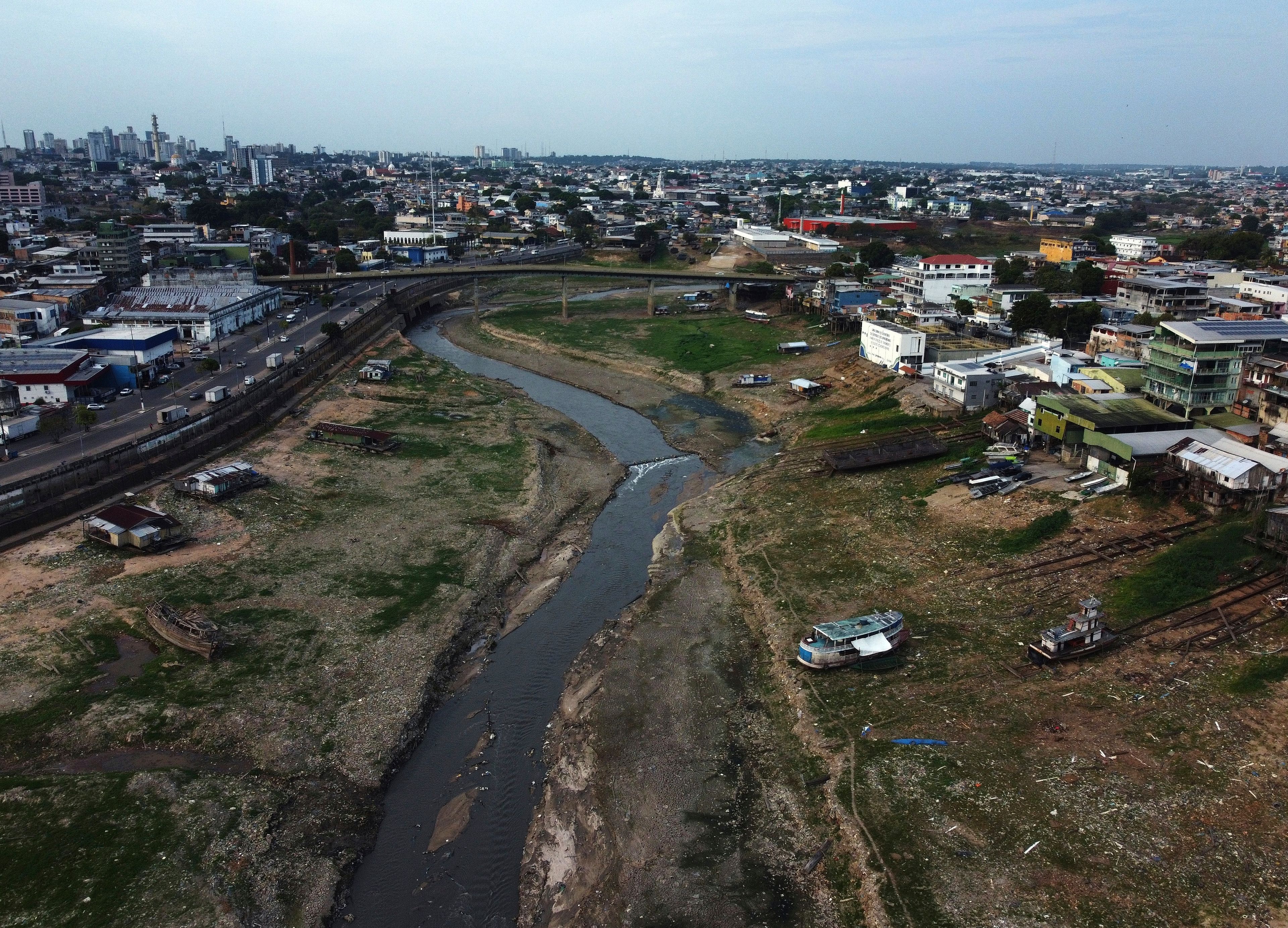 Part of the Educandos that connects to the Negro River is visible amid a drought in Manaus, state of Amazonas, Brazil, Wednesday, Sept. 25, 2024. (AP Photo/Edmar Barros)