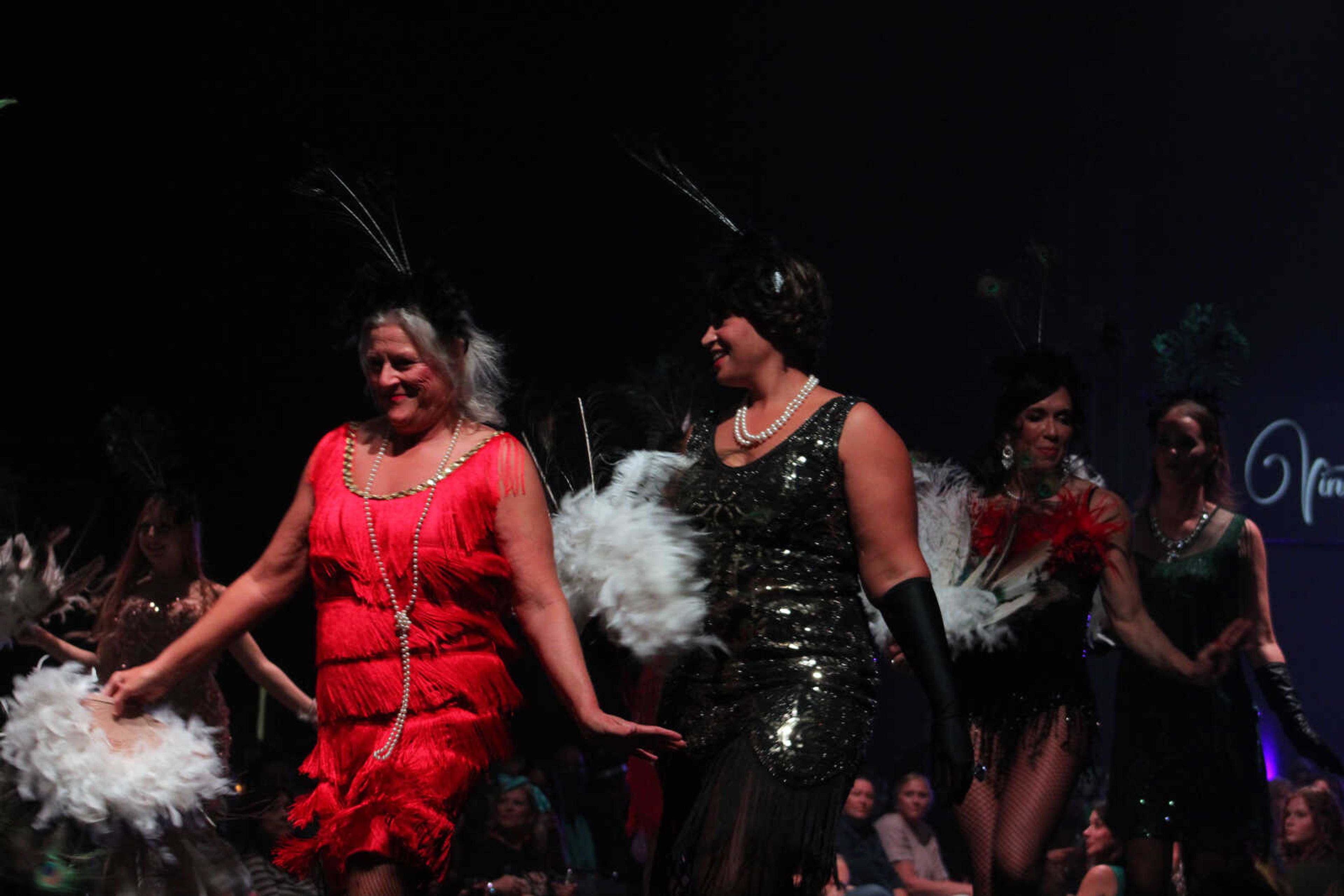 Community women perform as models and dancers in the 11th VintageNOW fashion show Saturday, Oct. 9, 2021, at the Show Me Center in Cape Girardeau.