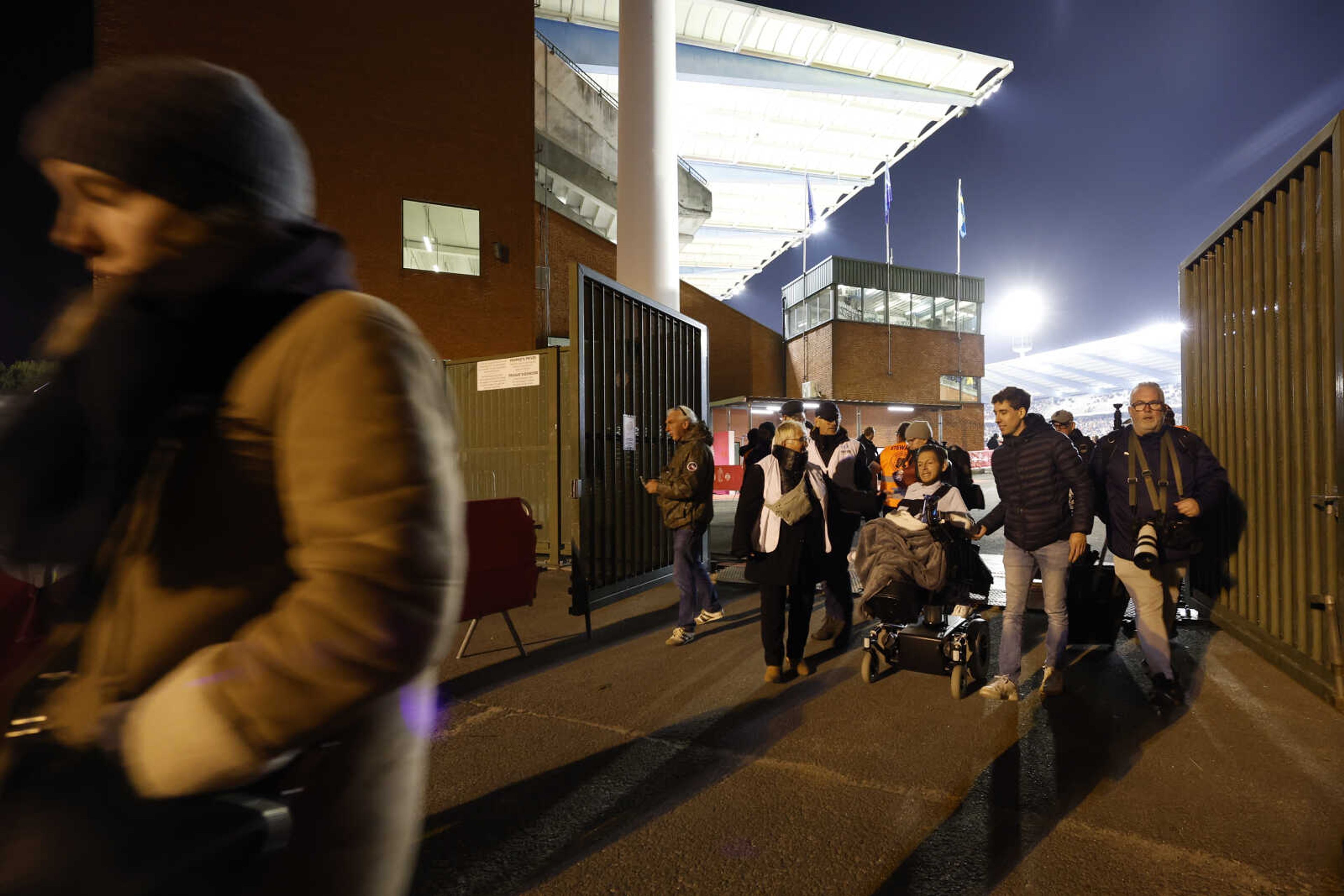 Supporters walk away from the venue after suspension of the Euro 2024 group F qualifying soccer match between Belgium and Sweden at the King Baudouin Stadium in Brussels, Monday, Oct. 16, 2023. The match was abandoned at halftime after two Swedes were killed in a shooting in central Brussels before kickoff. (AP Photo/Geert Vanden Wijngaert)