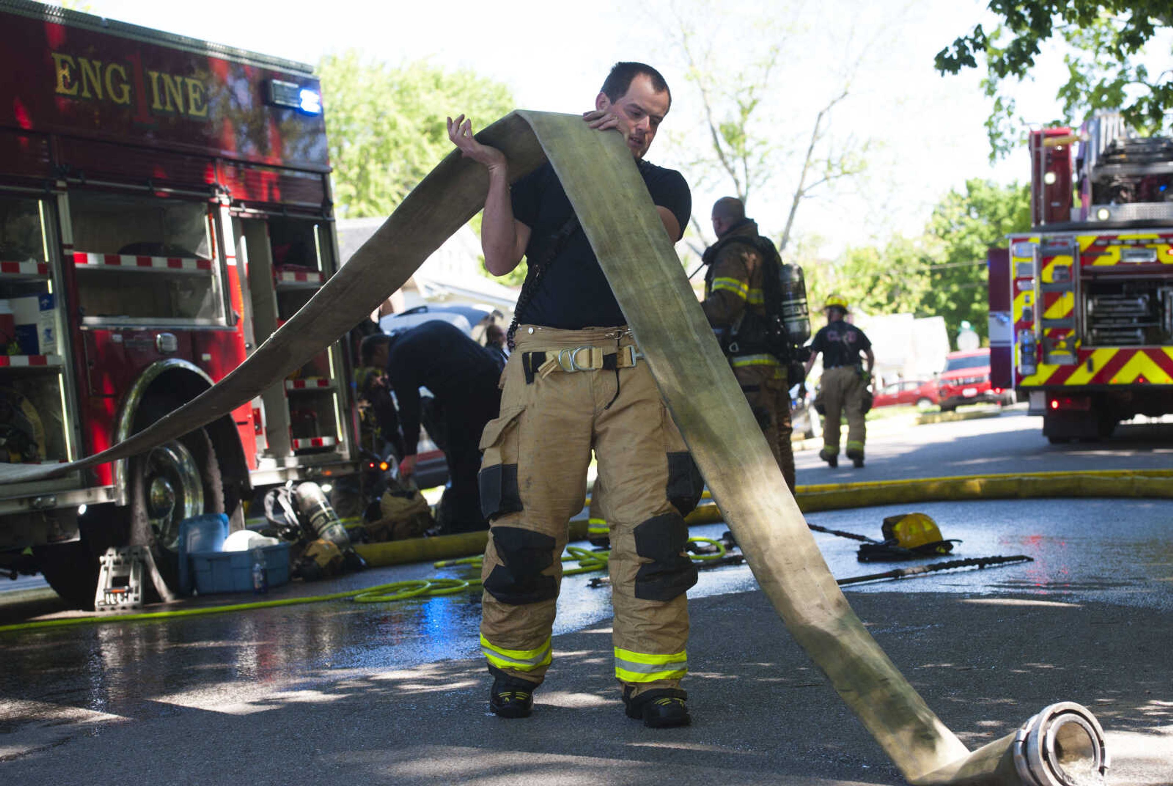 Members of the Cape Girardeau Fire Department respond to the scene of a structure fire Monday, May 11, 2020, at 40 North Henderson Ave. in Cape Girardeau.