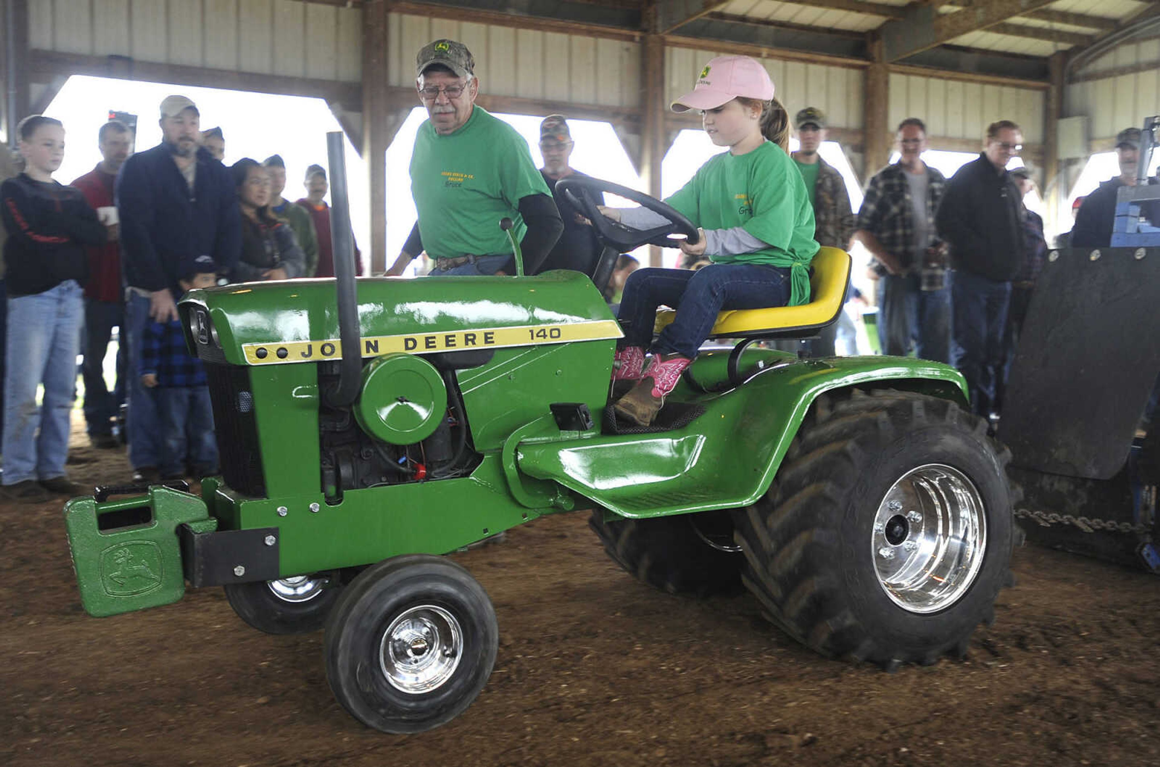 FRED LYNCH ~ flynch@semissourian.com
Gracie Campbell of Puxico, Missouri drives a John Deere 140 in the lawn and garden tractor pull at the Cousin Carl Farm Show on Saturday, March 12, 2016 at Arena Park.