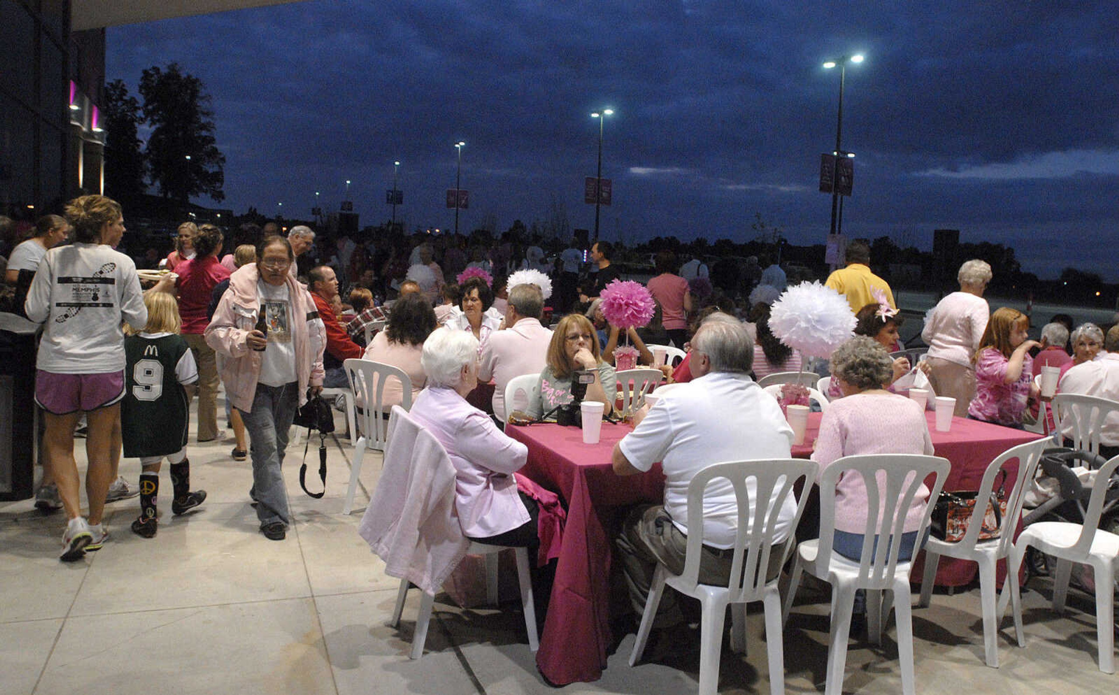 LAURA SIMON ~ lsimon@semissourian.com
Around 300 people line the outside of the Cancer Institute which is highlighted with pink lights during the Pink Up Cape celebration Wednesday, September 28, 2011 at Saint Francis Medical Center in Cape Girardeau. The celebration kicks off Breast Cancer Awareness Month. Saint Francis Medical Center's Pink Up Cape is a breast cancer awareness campaign and the funds benefit Dig for Life which provides free mammograms to local women who could otherwise not afford to have one.