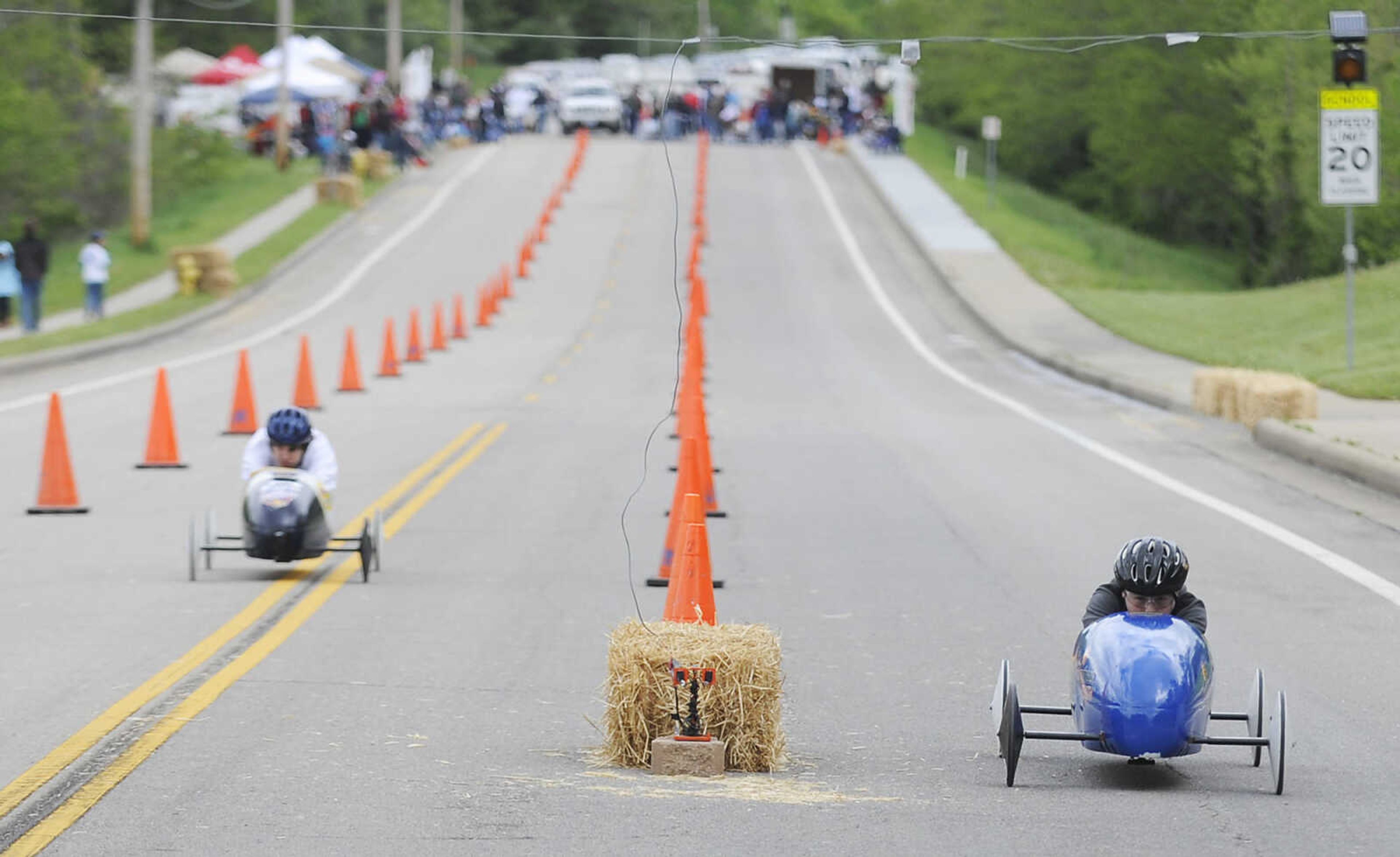 Erik Wilson, of Jackson, 14, left, and Brent Glenzy, 11, of Kelso, Mo., race down Sprigg Street during the 2013 Soap Box Derby Saturday, May 4, at Blanchard Elementary School, 1829 N. Sprigg St., in Cape Girardeau. Racers ranging in age from 7 to 17 competed in two divisions at the event which is a fundraiser for the Cape Girardeau Rotary Club. The winners in each division will go on to compete in the All-American Soap Box Derby held in Akron, Ohio in July.