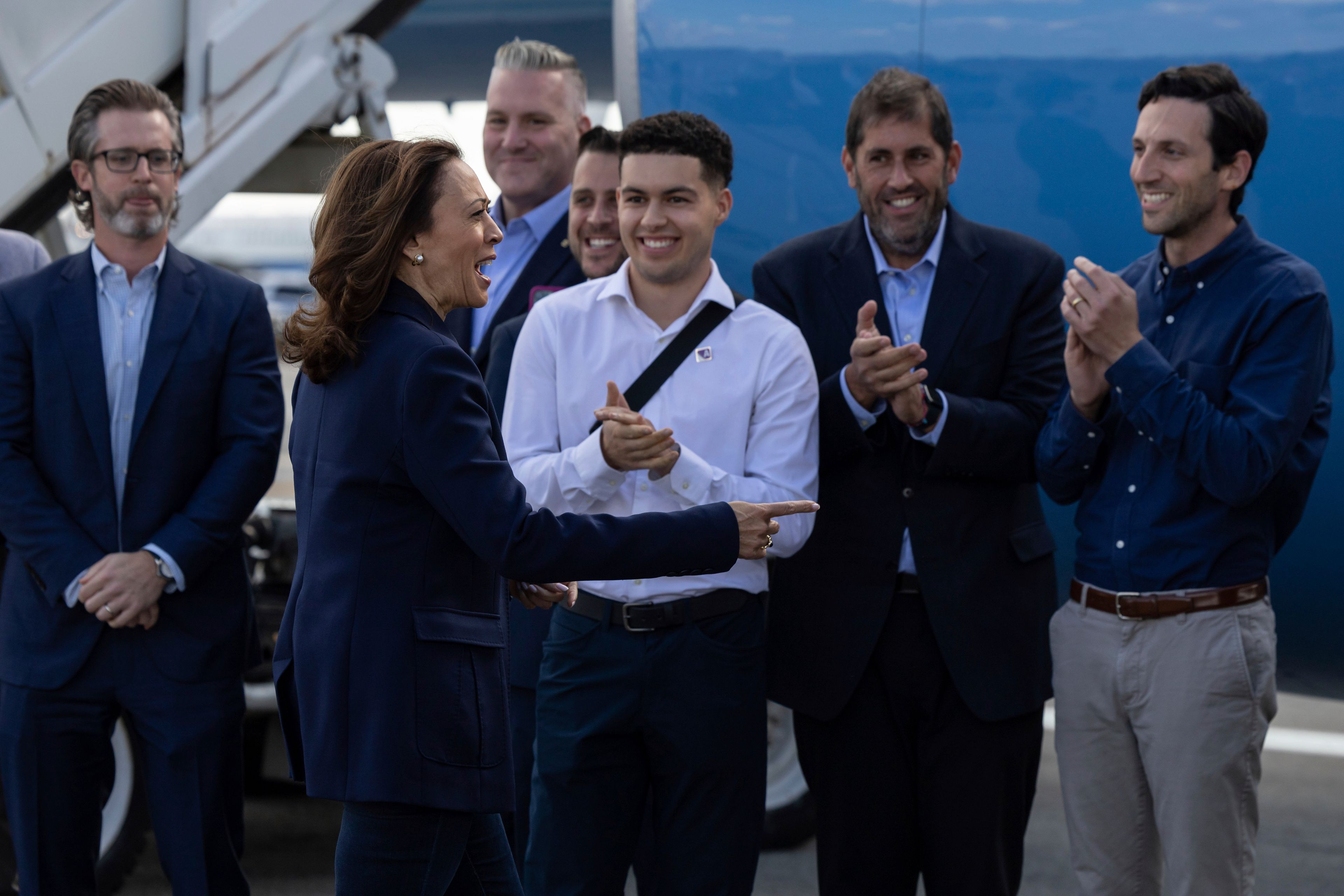 Democratic presidential nominee Vice President Kamala Harris is greeted by volunteers as she walks to board Air Force Two at LaGuardia International Airport, Wednesday, Oct. 9, 2024, in New York. (AP Photo/Yuki Iwamura)