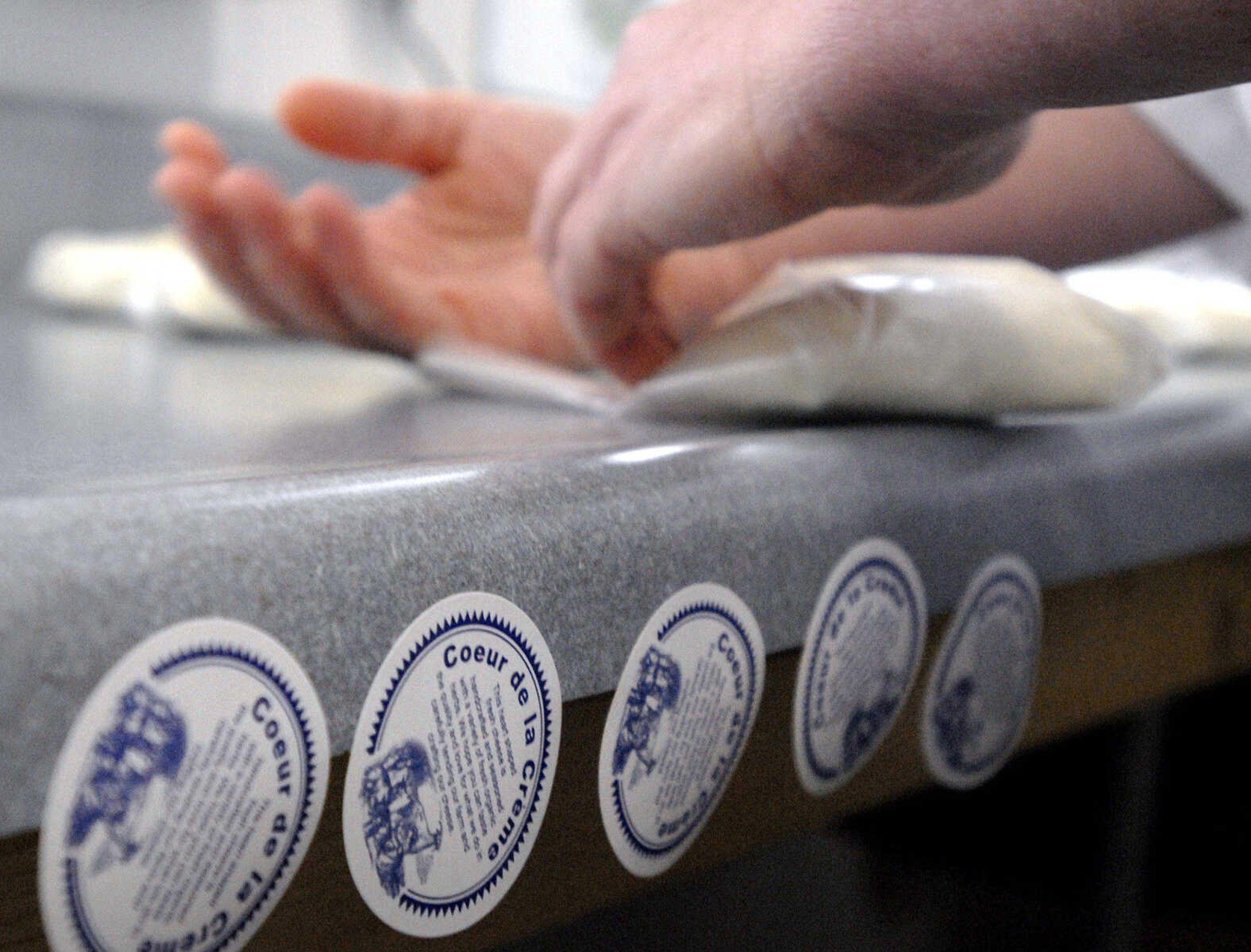 LAURA SIMON ~ lsimon@semissourian.com
Veronica Baetje hand wraps heart shaped Coeur de la Creme, pure artisan goat cheese Wednesday, Dec. 14, 2011 at Baetje Farms in Bloomsdale, Mo.