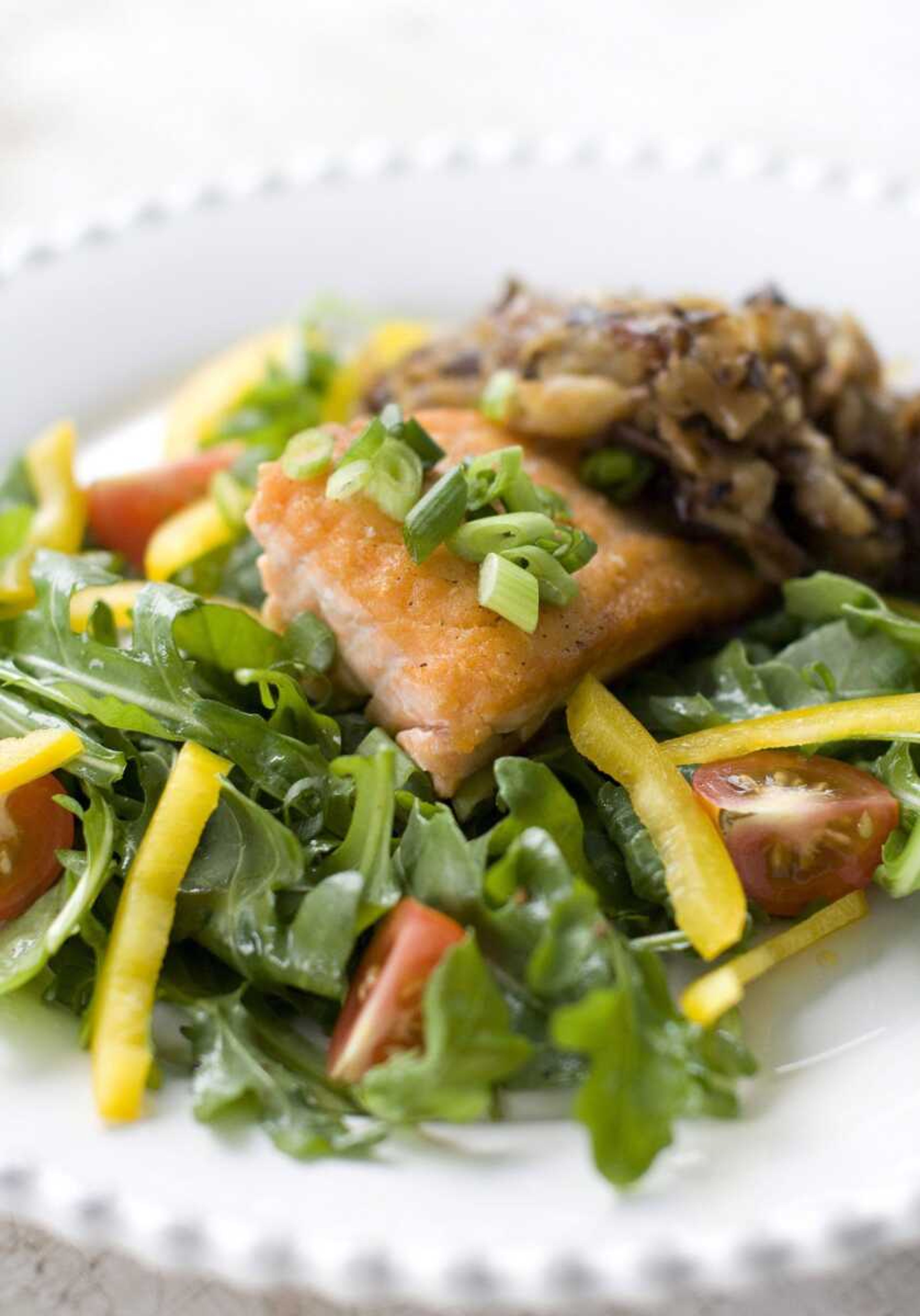 The earthy flavor of shiitake mushrooms mixed with shredded potatoes complements salmon. (Matthew Mead ~ Associated Press)