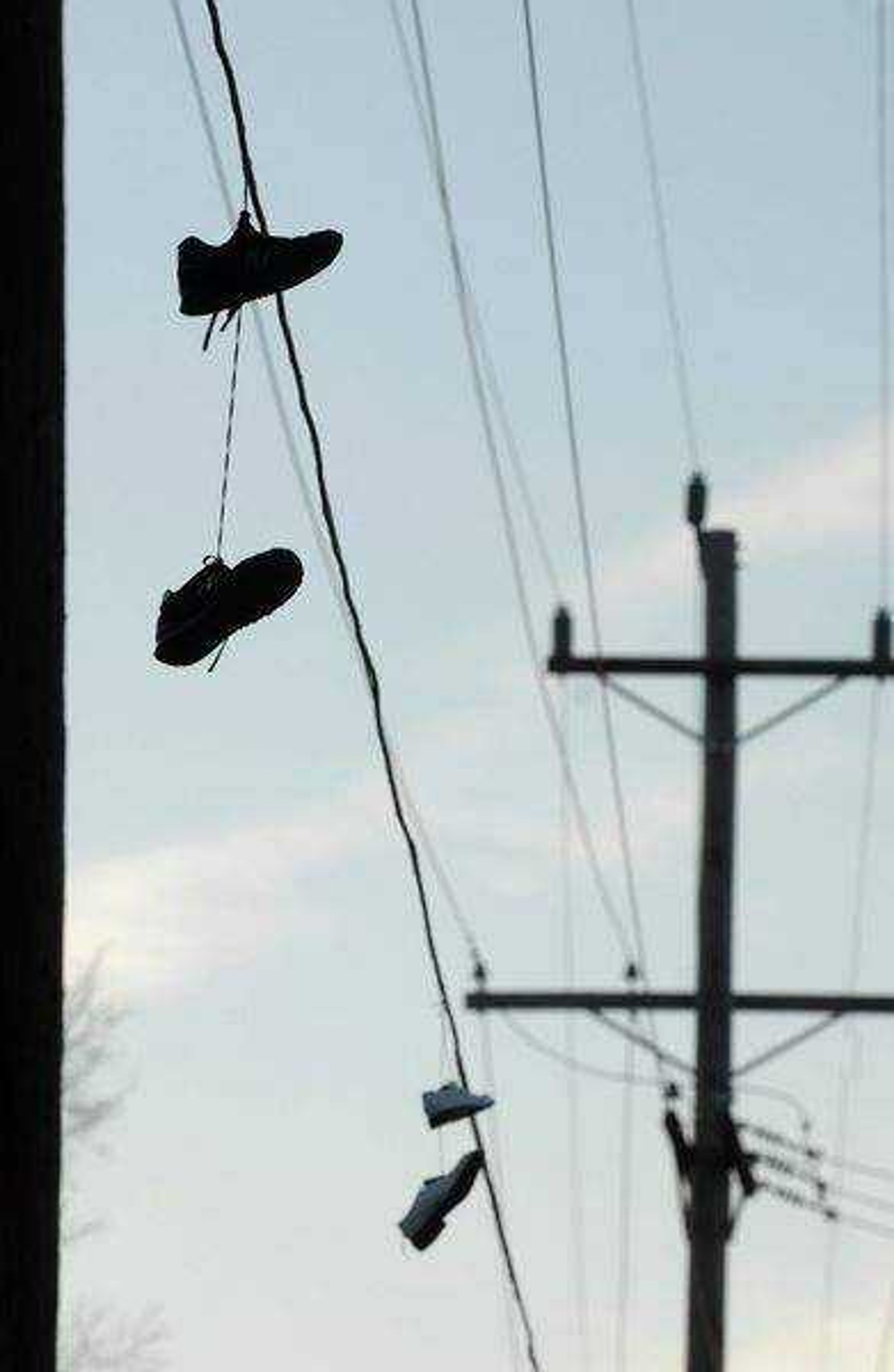 KIT DOYLE ~ kdoyle@semissourian.com<br>Shoes hang from utility lines near the intersection of Bloomfield and Park in Cape Girardeau.