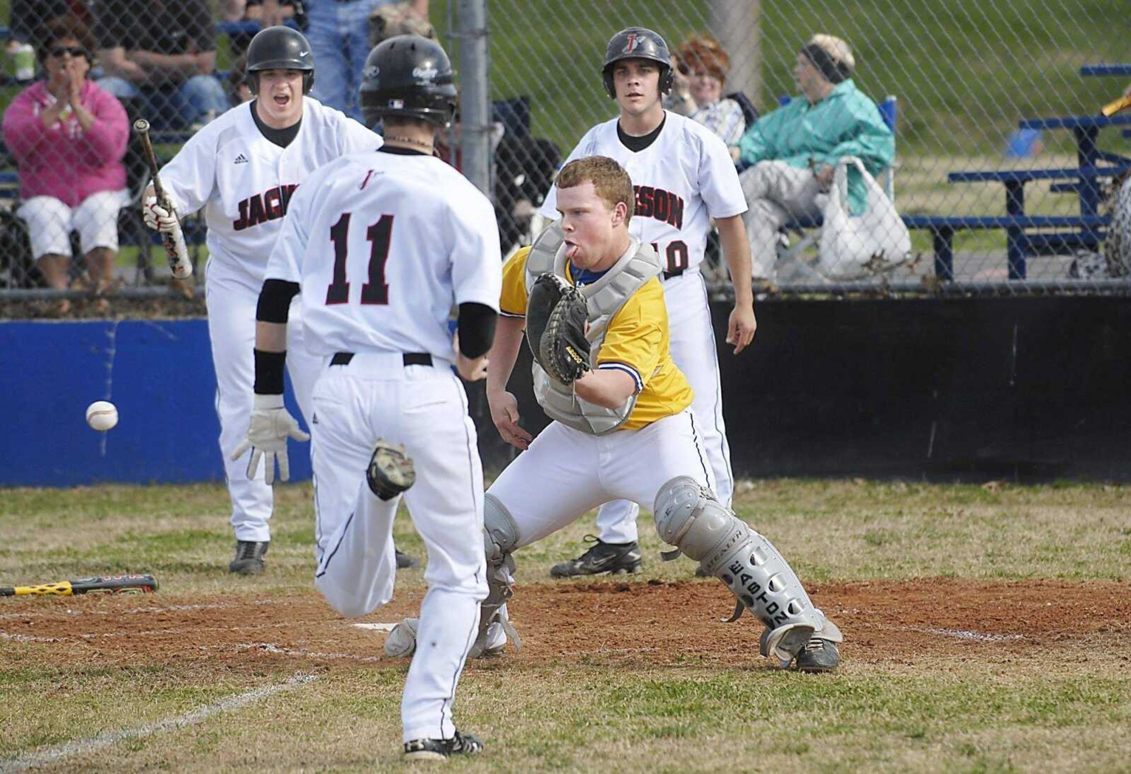 KIT DOYLE ~ kdoyle@semissourian.com<br>Scott City catcher Jaris Hye fields a throw as Jackson's Josh Duncan rumbles toward home during the first inning Monday at Scott City. Duncan scored on the play.