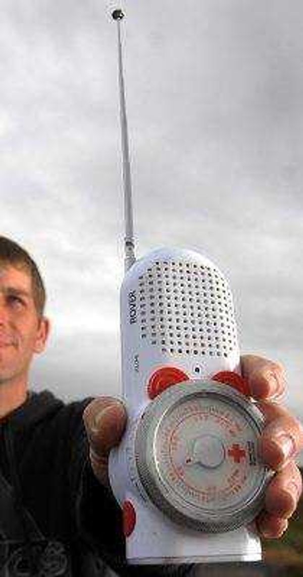 David Patterson stands with his weather radio in hand at one of his favorite weather watching spots in Southern Illinois.