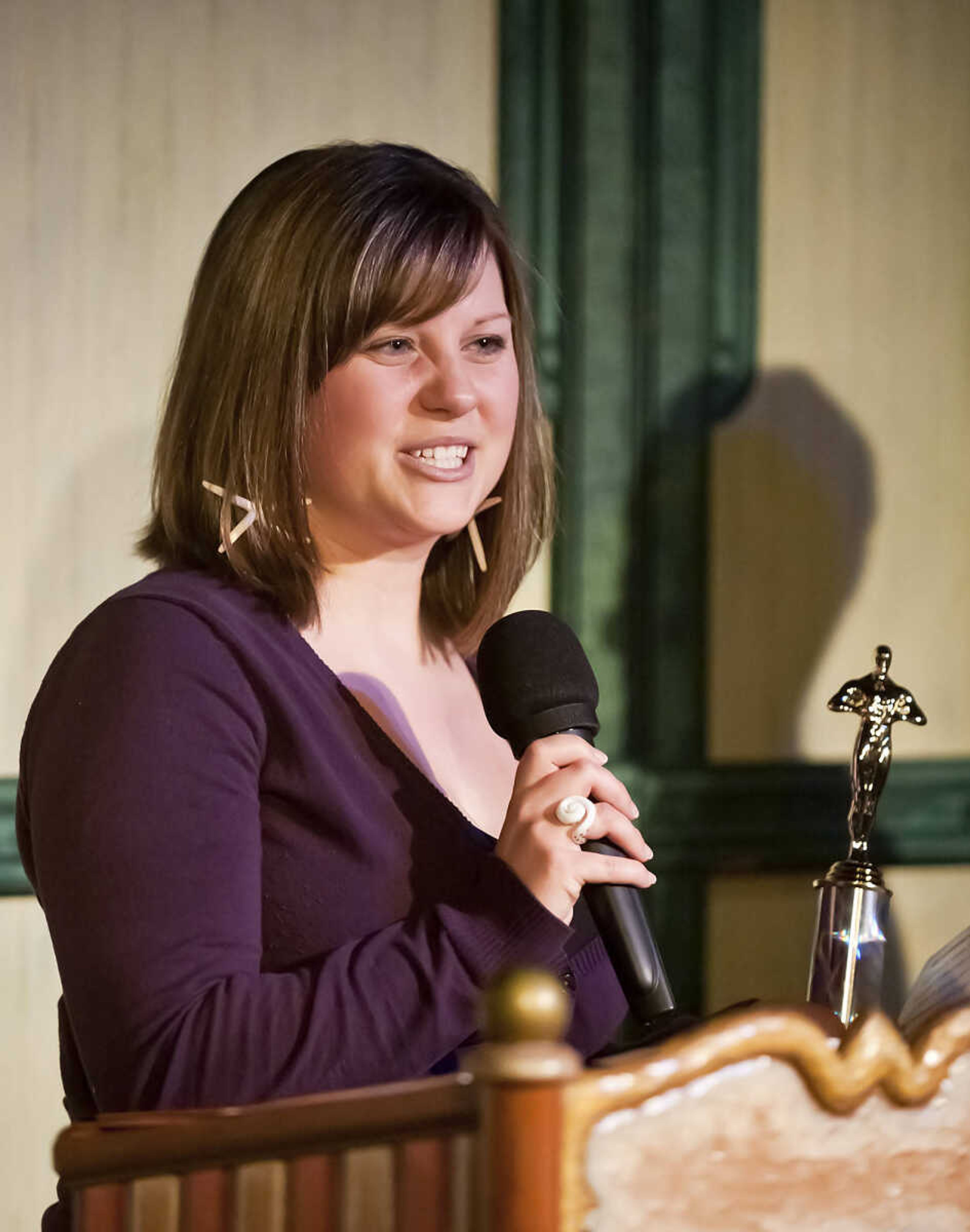 Katrina Toeniskoetter speaks after accepting her husband Michael's Abbott Award for best supporting actor for her husband, Micheal, during the Abbott Awards, the River City Players' annual awards ceremony, Saturday, Jan. 18, at Port Cape in downtown Cape Girardeau. Auditions for the first production of the 2014 season, "Quiet on the Set," will be held at 7 p.m. Jan. 29 and 30 at Port Cape.