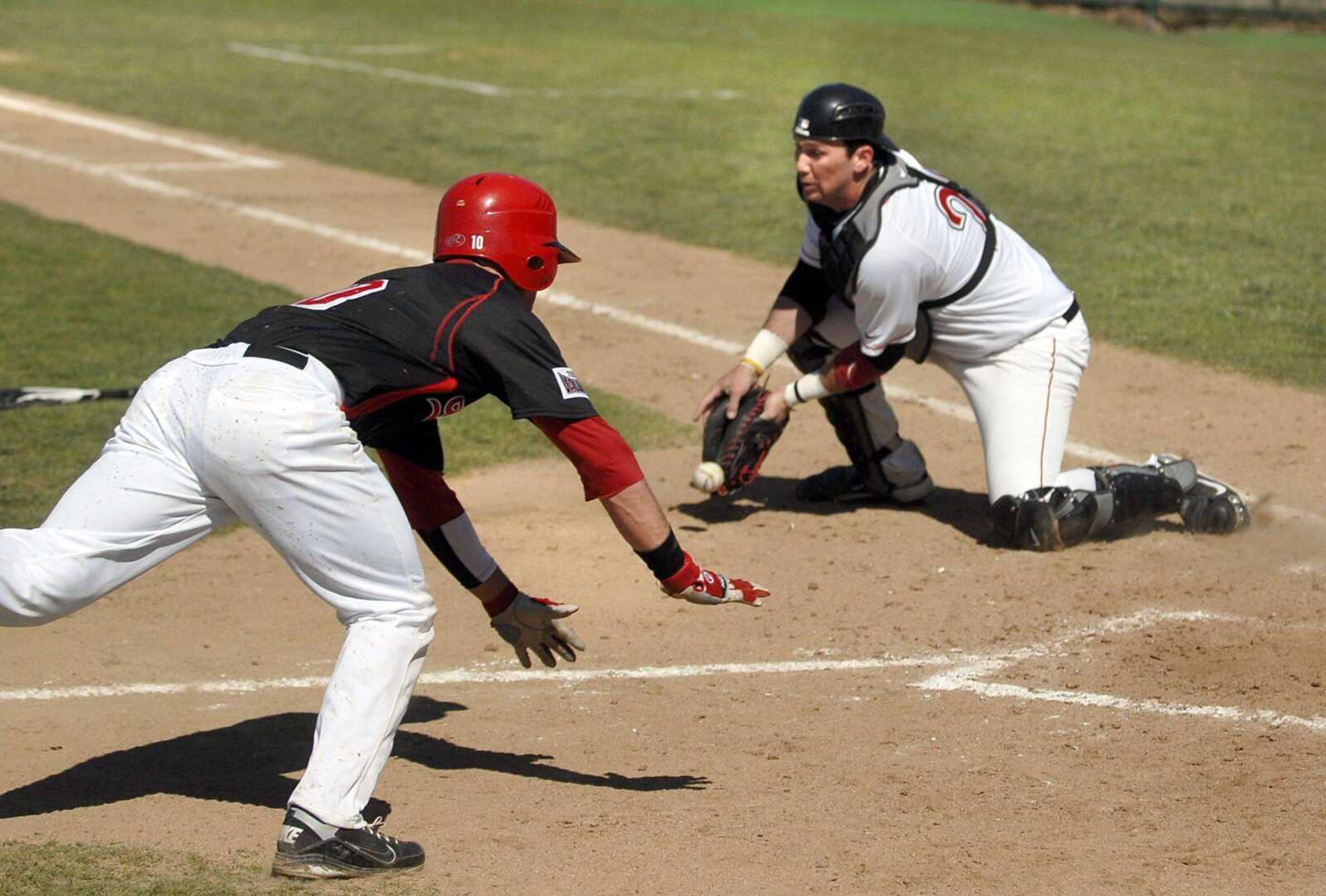 Illinois State's Ty Wiesemeyer safely slides home before Southeast Missouri State catcher Kody Campbell can field the ball and apply the tag during the fourth inning of their first game Saturday at Capaha Field. (Laura Simon)