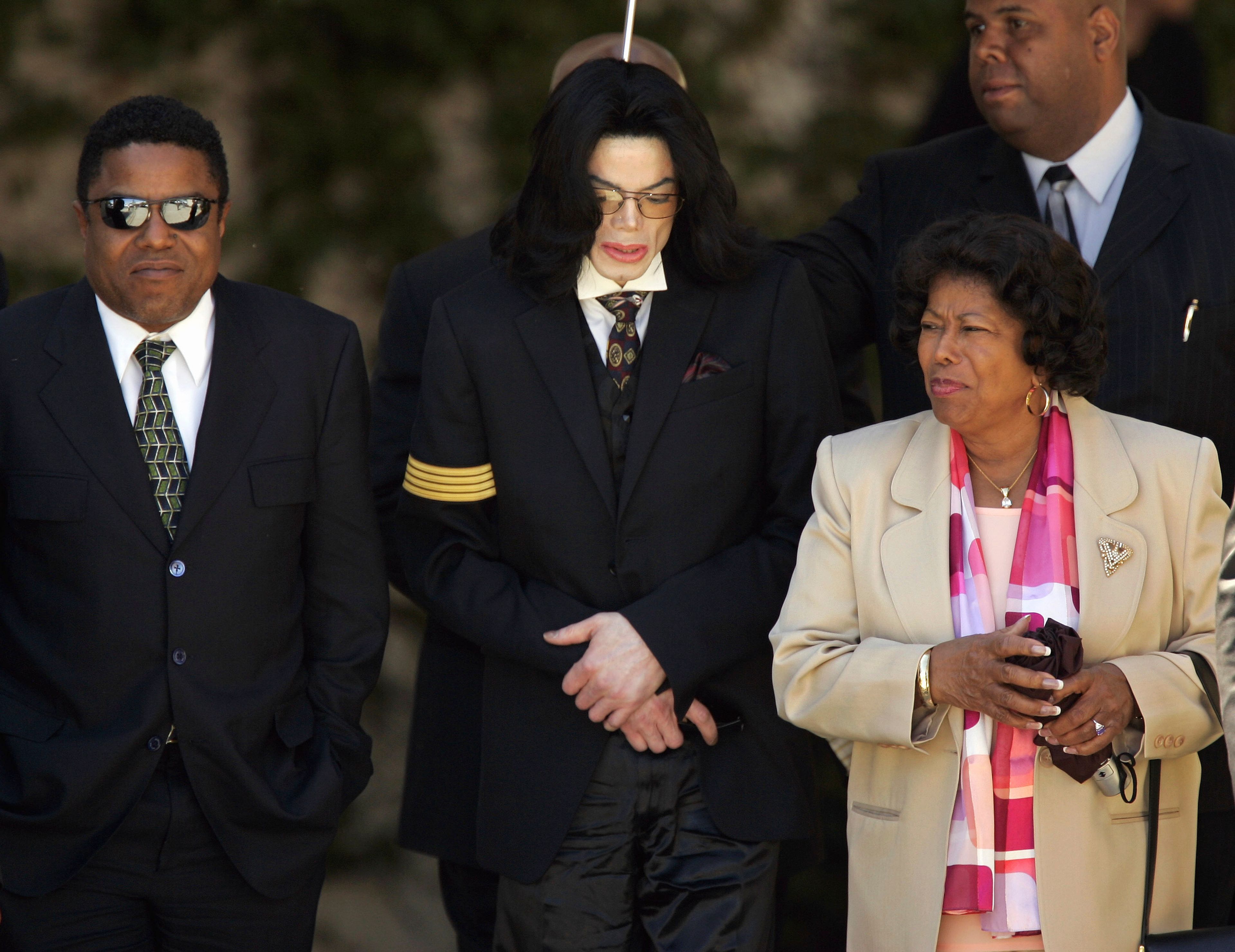 FILE - Pop star Michael Jackson, center, his mother Katherine Jackson, right, and brother Tito Jackson, left, leave Santa Barbara County Superior Court in Santa Maria, Calif., April 7, 2005, after another day of testimony in Michael Jackson's child molestation trial. (AP Photo/Kevork Djansezian, File)