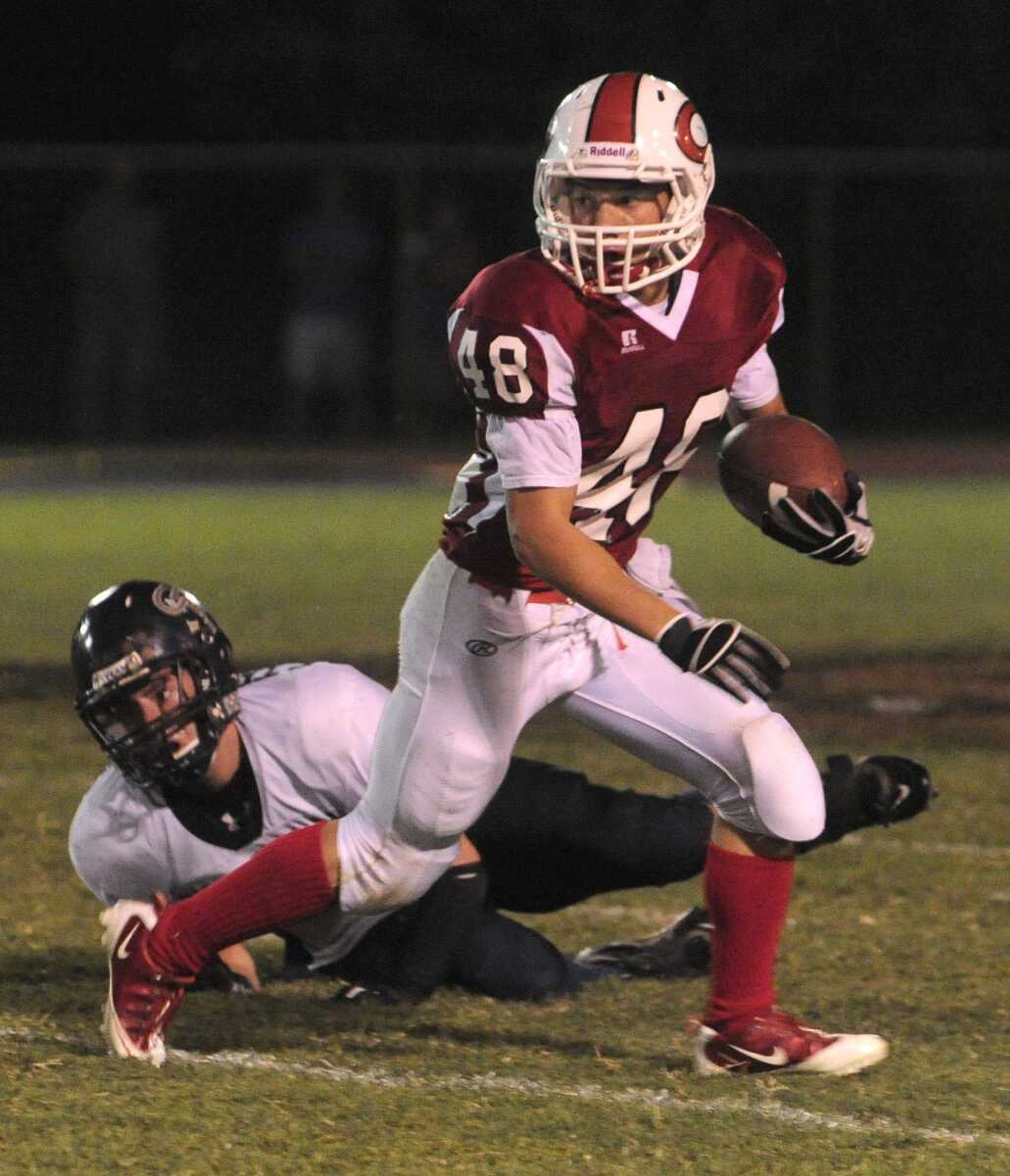 Chaffee's Tyson Estes gets away from St. Pius' Evan Temperato during the second quarter Friday at Chaffee High School. (Fred Lynch)