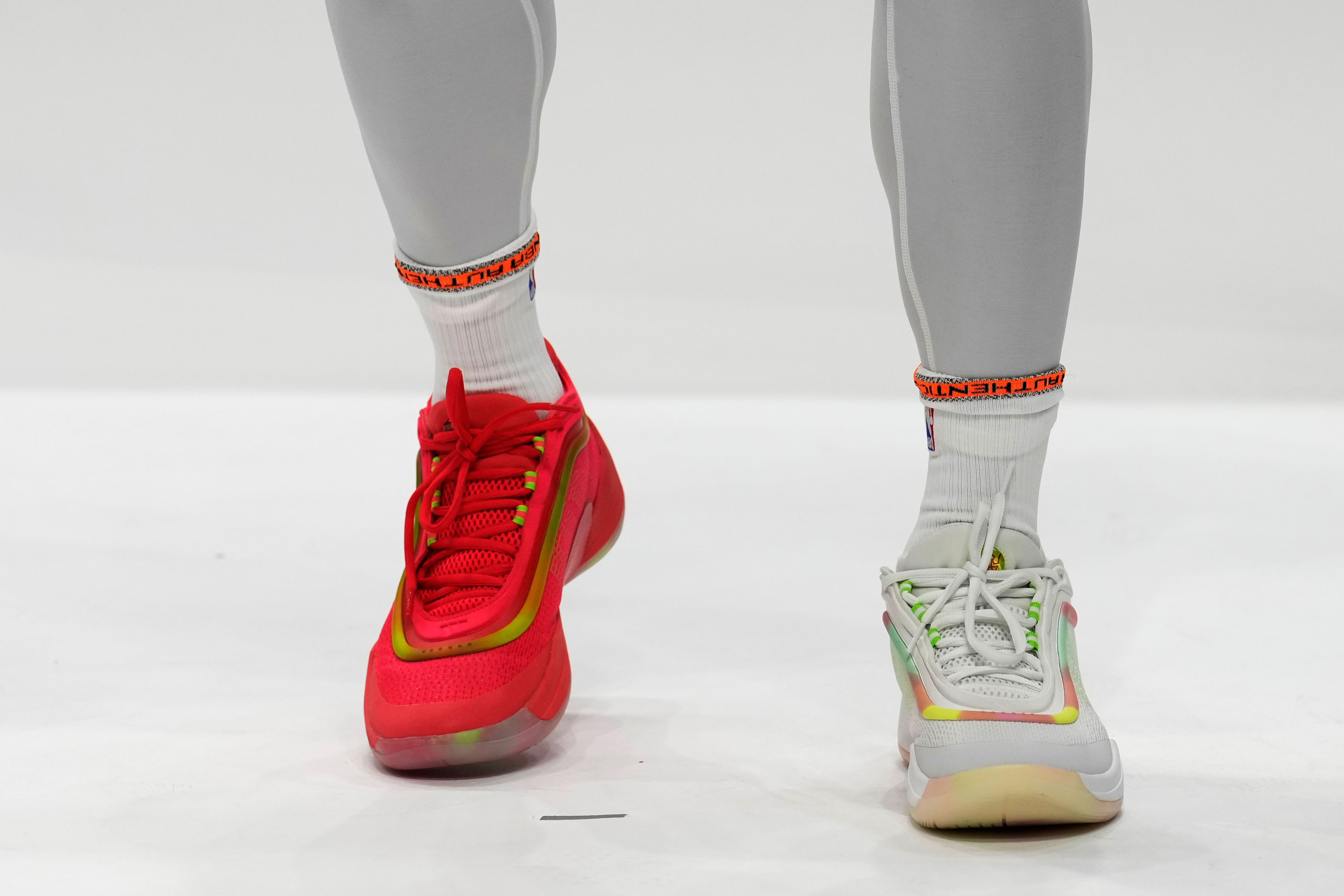 Cleveland Cavaliers guard Donovan Mitchell wears soon to be released Adidas with a gummy bear theme during an NBA basketball media day, Monday, Sept. 30, 2024, in Cleveland. (AP Photo/Sue Ogrocki)