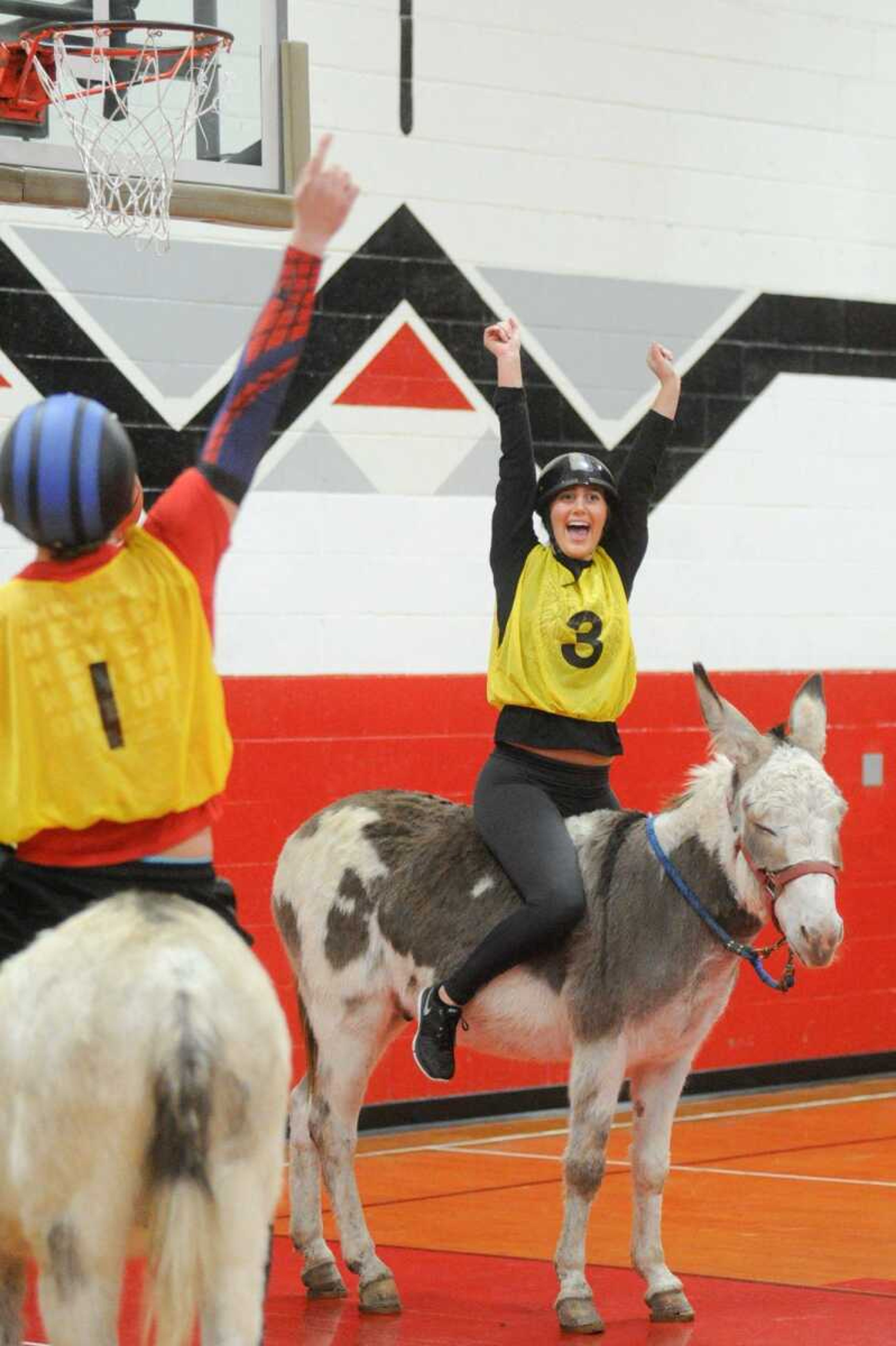 Jackson High School senior Lindsey Breer celebrates after scoring in the first quarter during the Project Graduation Donkey Basketball Game on Saturday in Jackson. More photos are in a gallery at semissourian.com. (glandberg@semissourian.com)