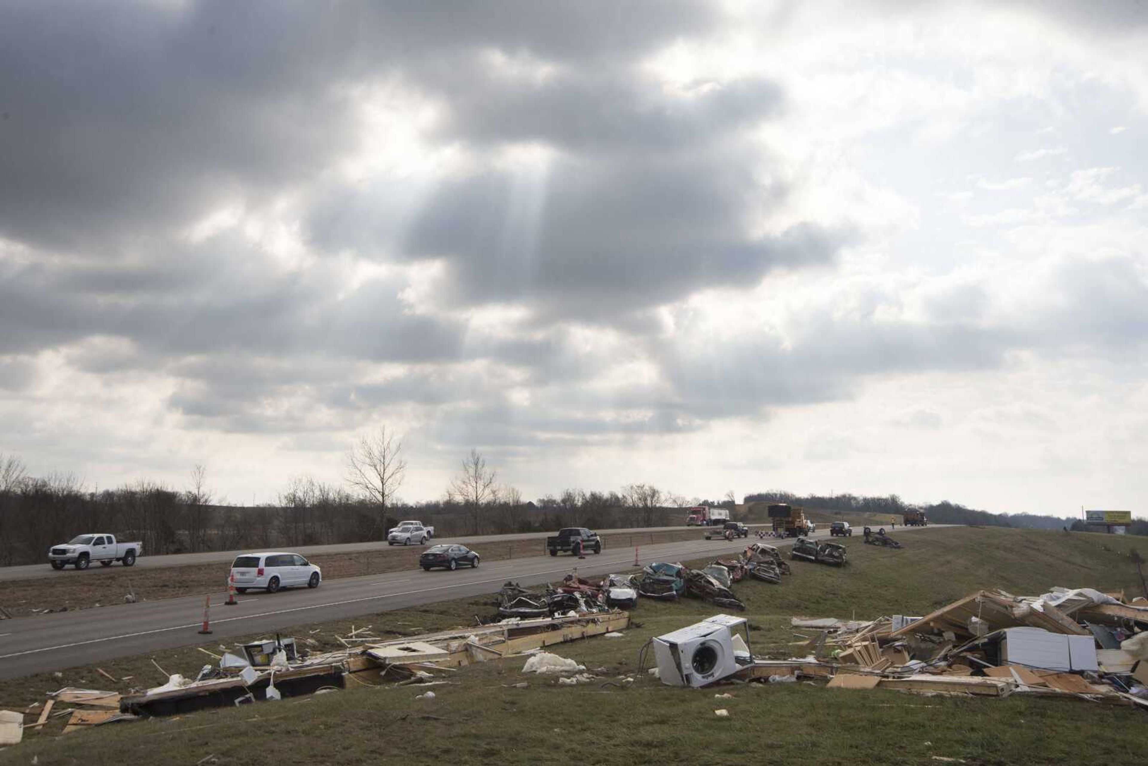 People help cleanup the damage left behind from a tornado along Perry County Road 806 near Kyle Lane on Wednesday, March 1, 2017, in Perry County.