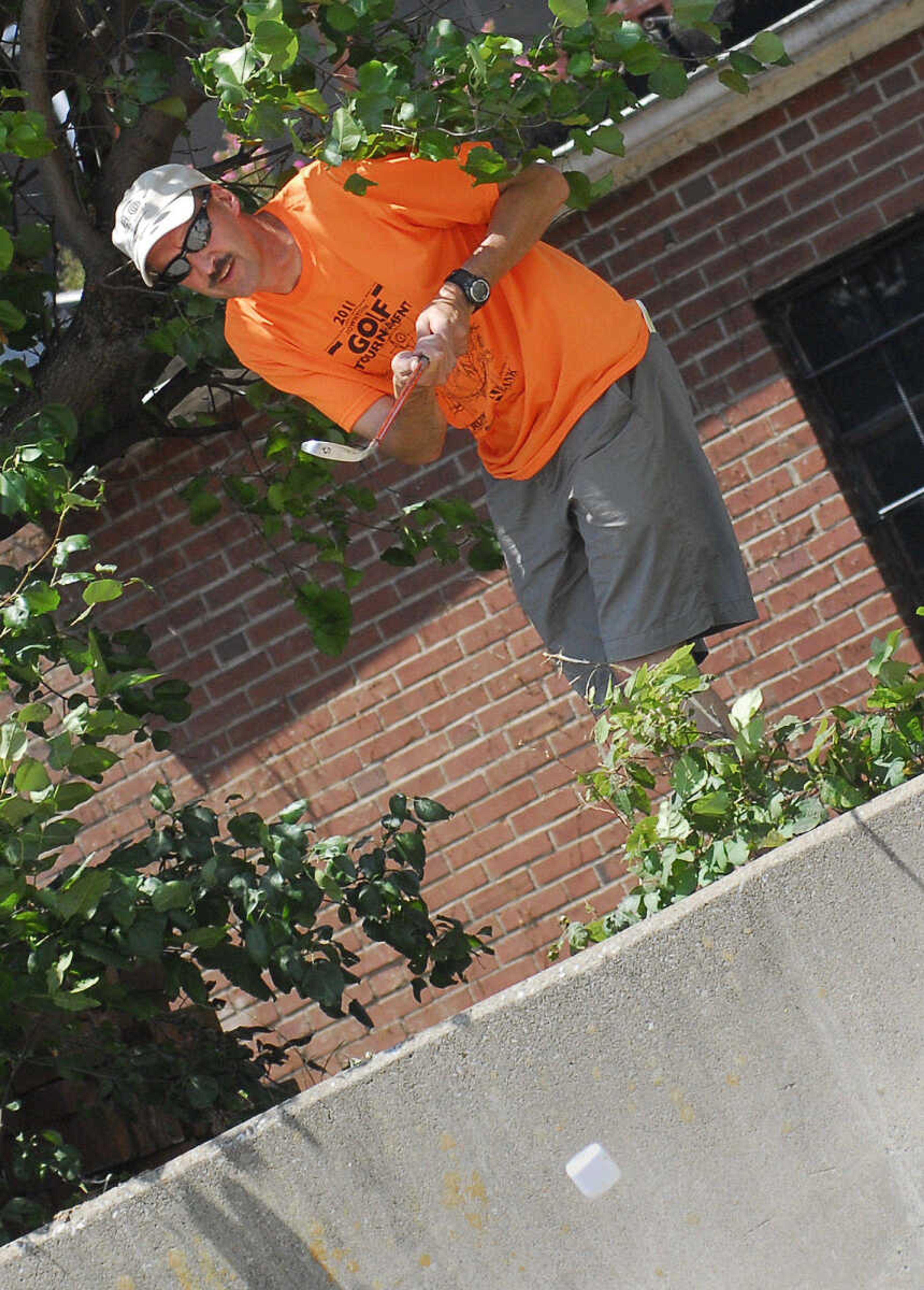 LAURA SIMON~lsimon@semissourian.com
Charlie Herbst hits his BirdieBall out from the weeds on the fifth hole Sunday, June 27, 2010 during the First-Ever Fifth Annual Louis J. Lorimier World Famous Downtown Golf Tournament in Cape Girardeau.