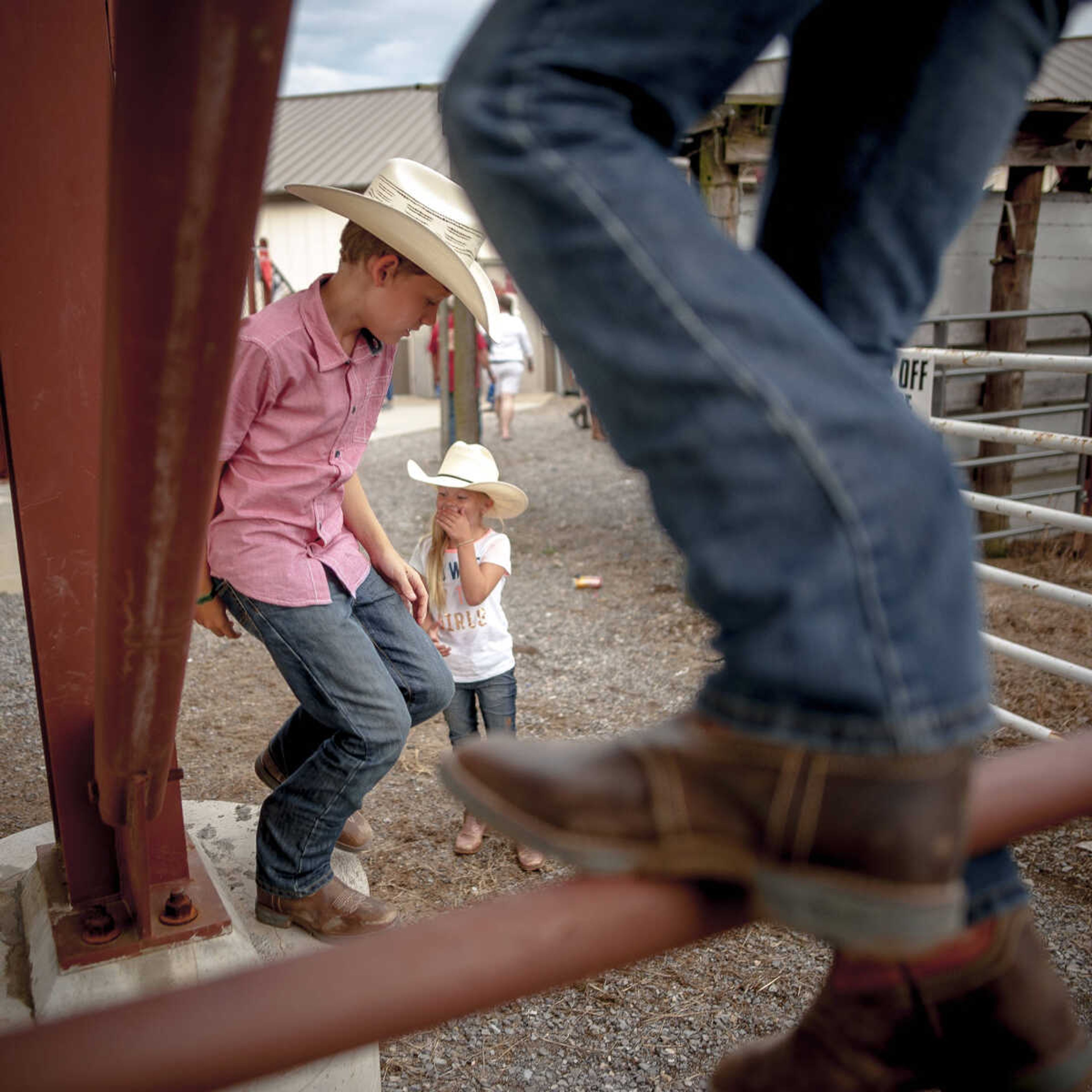 Children play underneath a section of bleachers before the start of the the&nbsp;Sikeston Jaycee Bootheel Rodeo on&nbsp;Wednesday, Aug. 7, 2019, in Sikeston, Missouri.&nbsp;