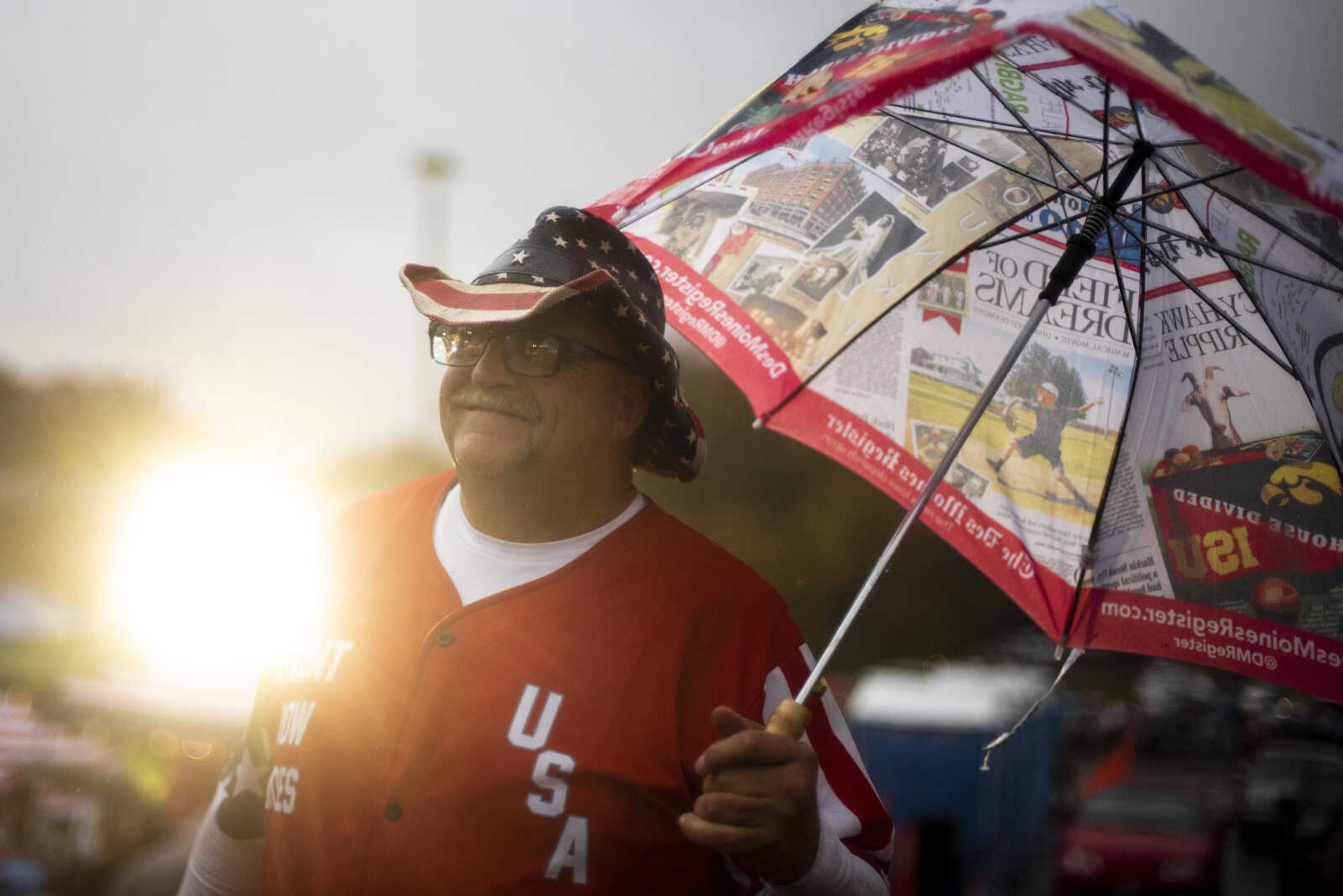 Randal Thom, 58, of Lakefield, Minnesota, carries an umbrella while waiting in line outside of the Show Me Center Monday, Nov. 5, 2018, in Cape Girardeau.