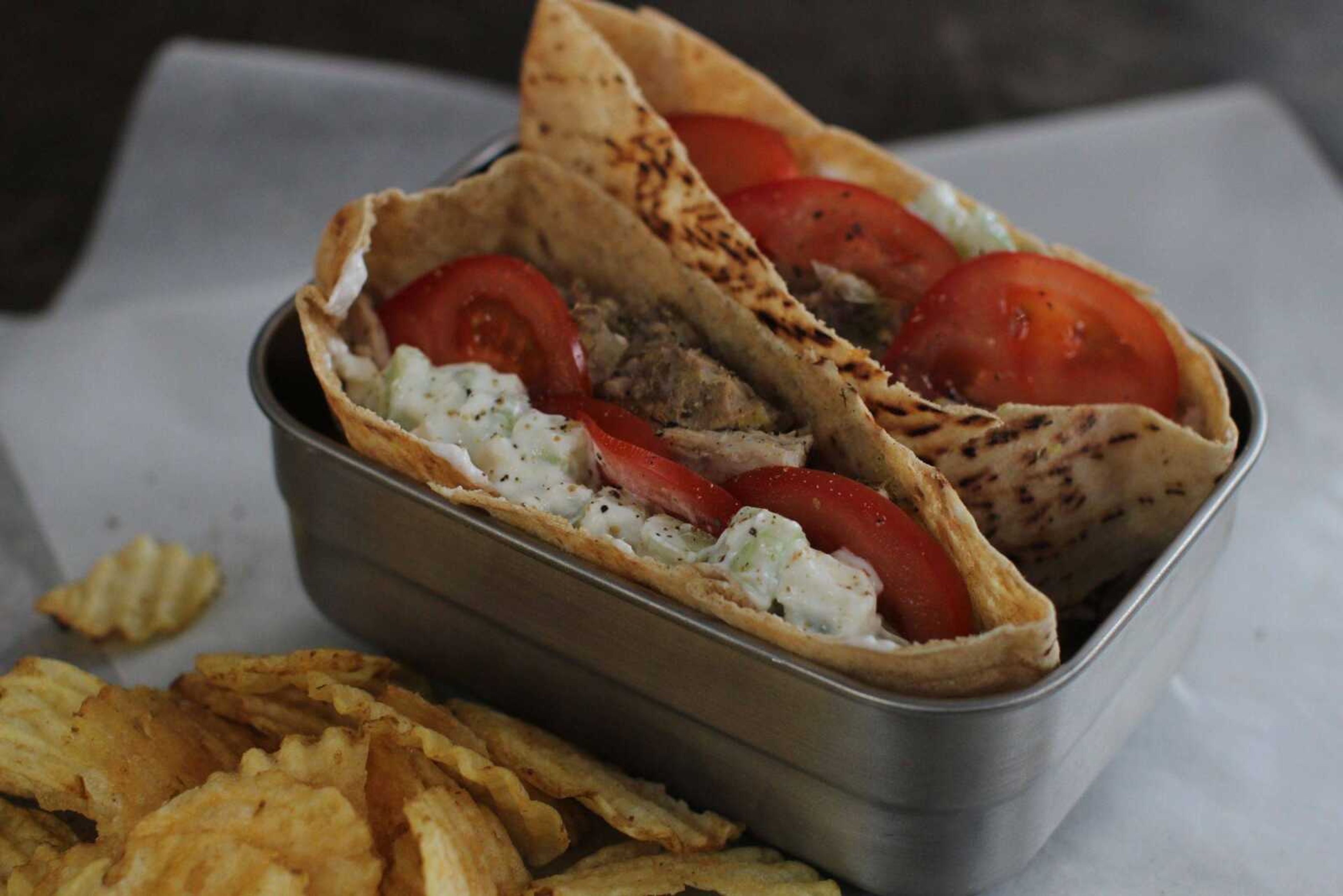 Cutline-File Credit:This Jan. 19 photo shows slow-cooker pulled-chicken Greek pitas in Concord, N.H. (Cutline-File Credit:Matthew Mead  ~ Associated Press)