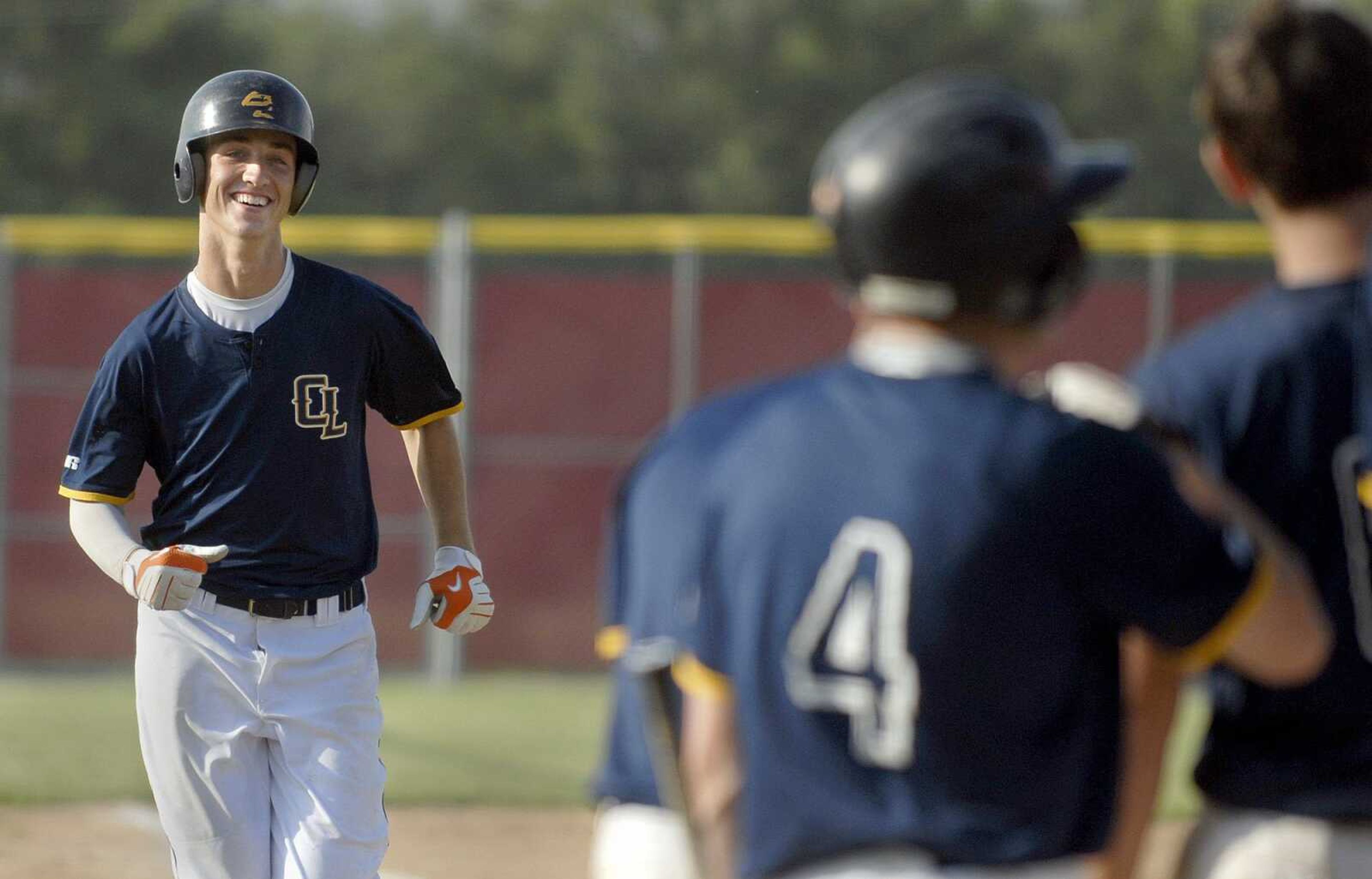 Cape Girardeau Post 63's Andrew Williams heads toward home plate after belting a home run against Jackson during the seventh inning of Tuesday's first game. (Laura Simon)