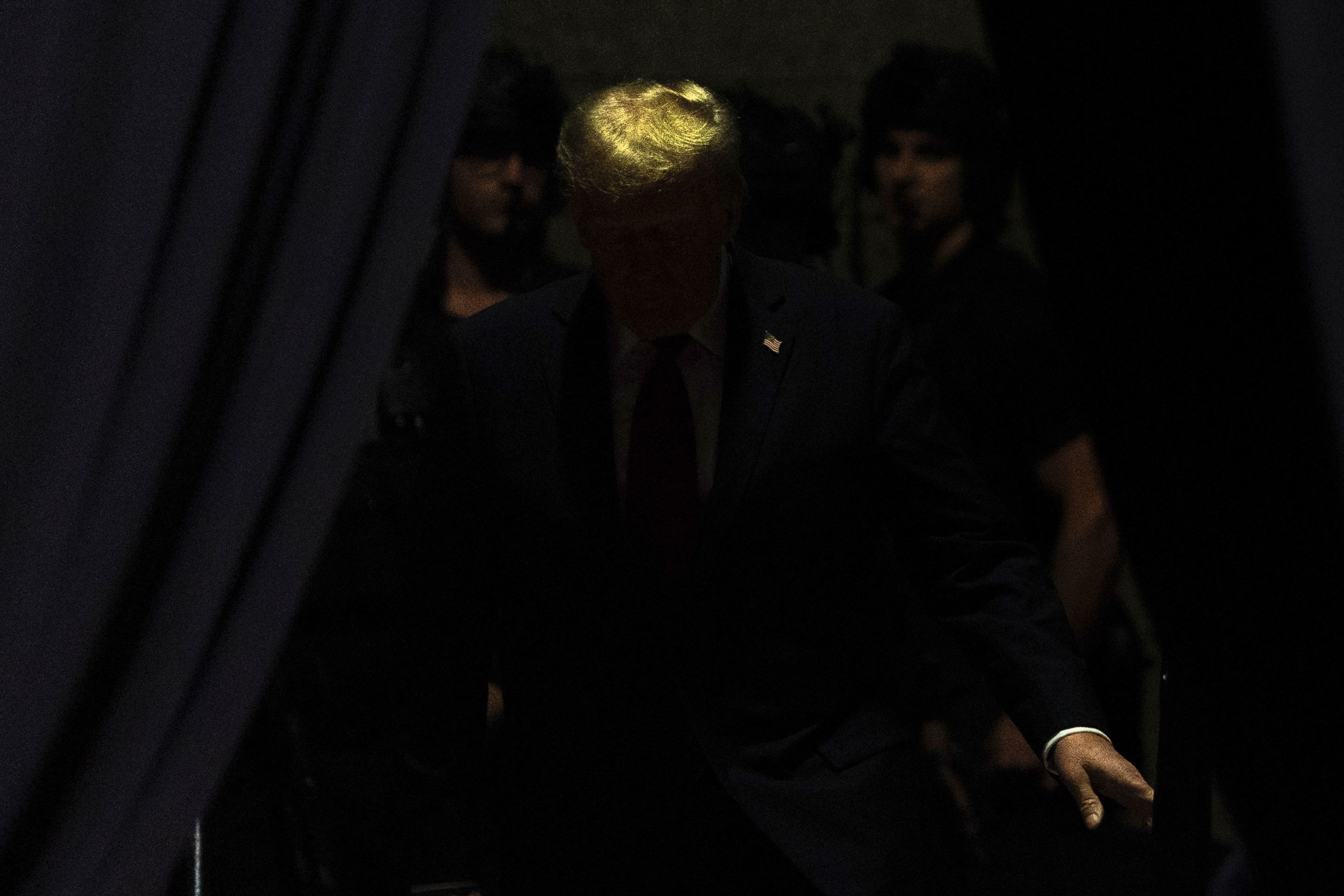 Republican presidential nominee former President Donald Trump prepares to walk on stage for a campaign rally at Macomb Community College in Warren, Mich., on Nov. 1, 2024. (AP Photo/Julia Demaree Nikhinson)