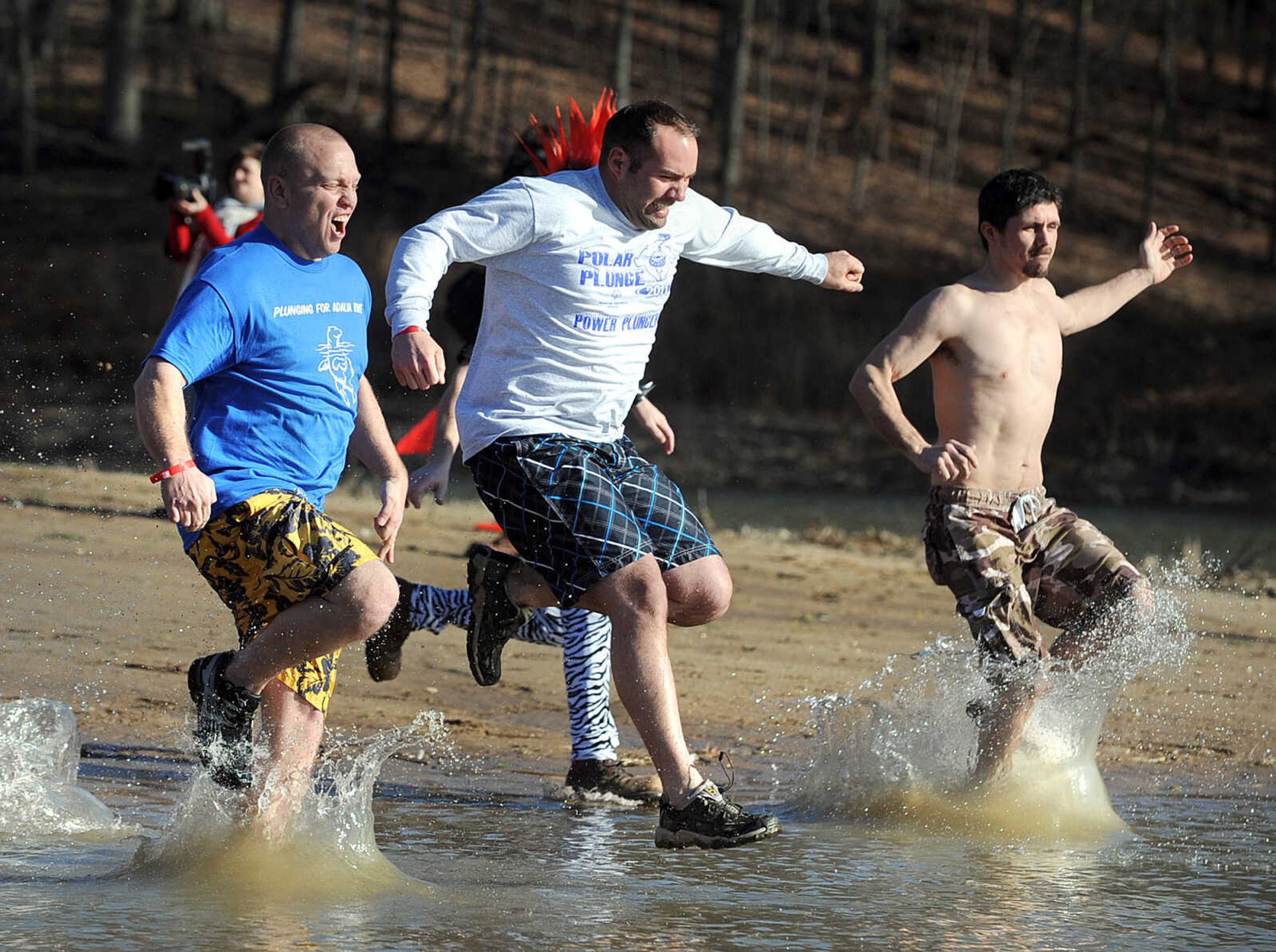 LAURA SIMON ~ lsimon@semissourian.com
People plunge into the cold waters of Lake Boutin Saturday afternoon, Feb. 2, 2013 during the Polar Plunge at Trail of Tears State Park. Thirty-six teams totaling 291 people took the annual plunge that benefits Special Olympics Missouri.