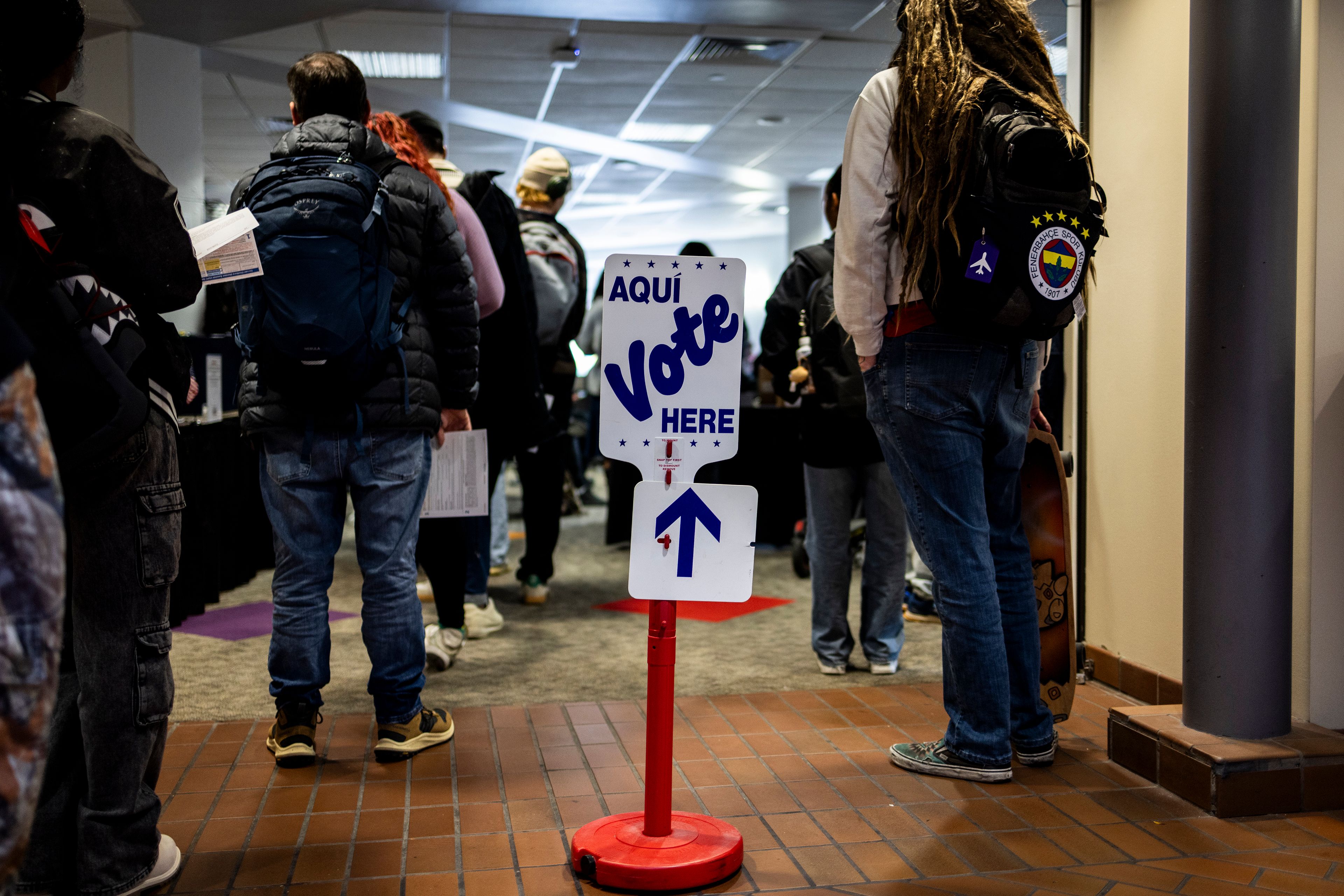 Voters wait in line to cast their ballots on Election Day, Tuesday, Nov. 5, 2024, in Denver. (AP Photo/Chet Strange)