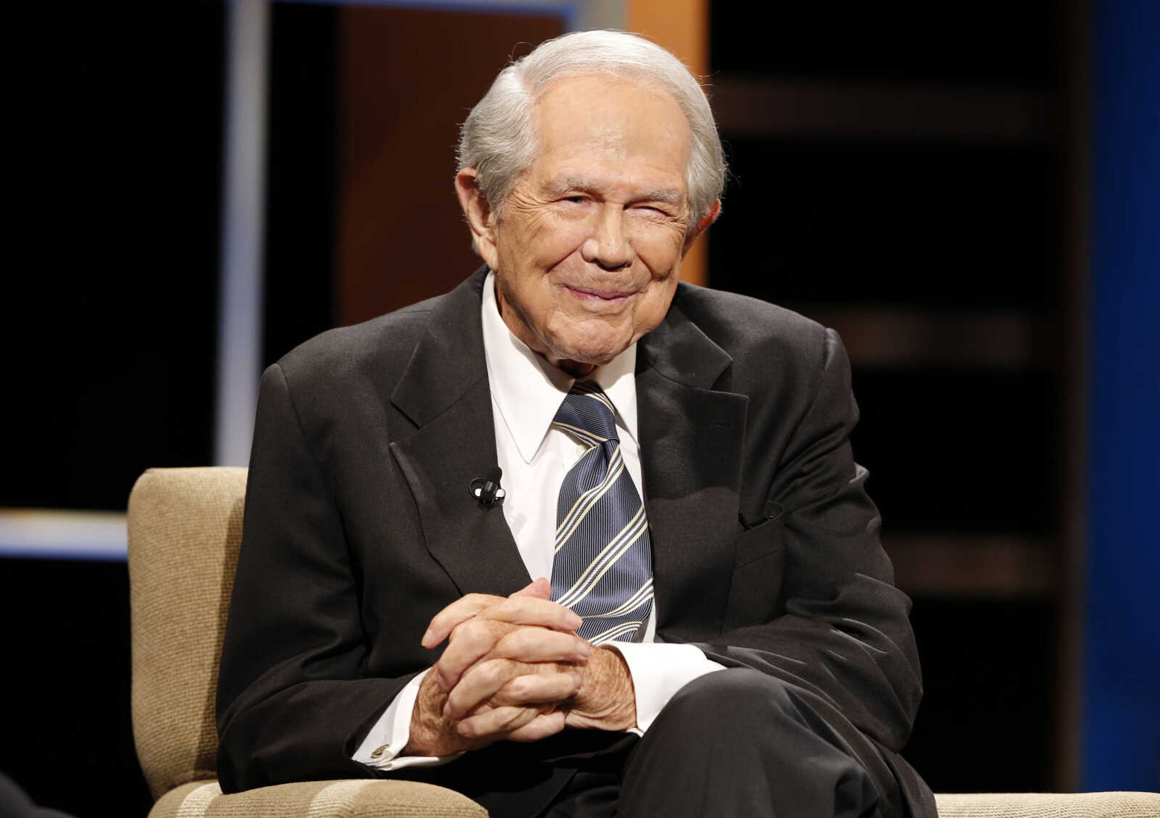 The Rev. Pat Robertson poses a question to a Republican presidential candidate during a forum at Regent University in Virginia Beach, Va., Oct. 23, 2015. Robertson, a religious broadcaster who turned a tiny Virginia station into the global Christian Broadcasting Network, tried a run for president and helped make religion central to Republican Party politics in America through his Christian Coalition, has died. He was 93. Robertson's death Thursday, June 8, 2023, was announced by his broadcasting network. 