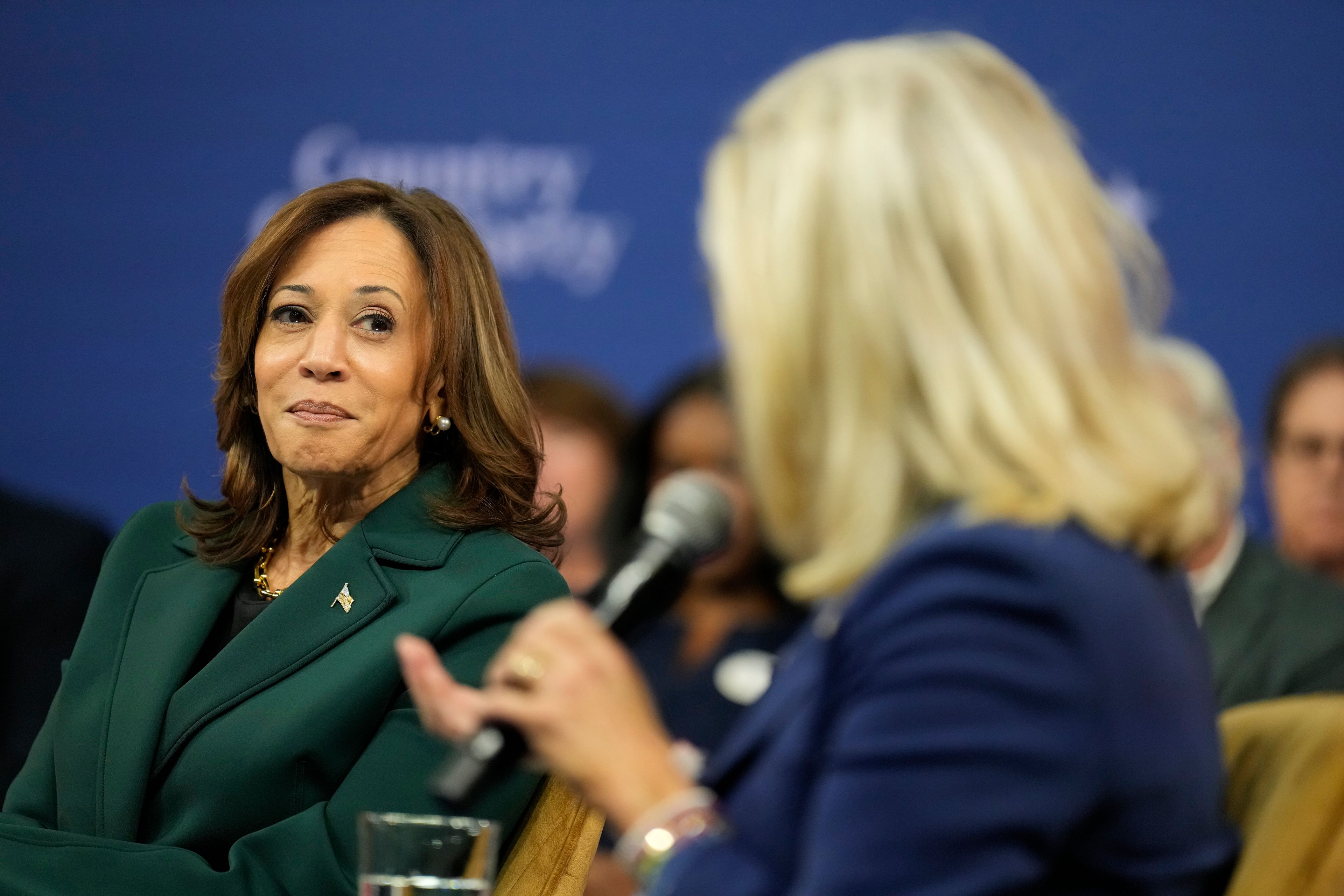 Democratic presidential nominee Vice President Kamala Harris listens as former Republican Congresswoman Liz Cheney speaks at The People's Light in Malvern, Pa., Monday, Oct. 21, 2024. (AP Photo/Jacquelyn Martin)