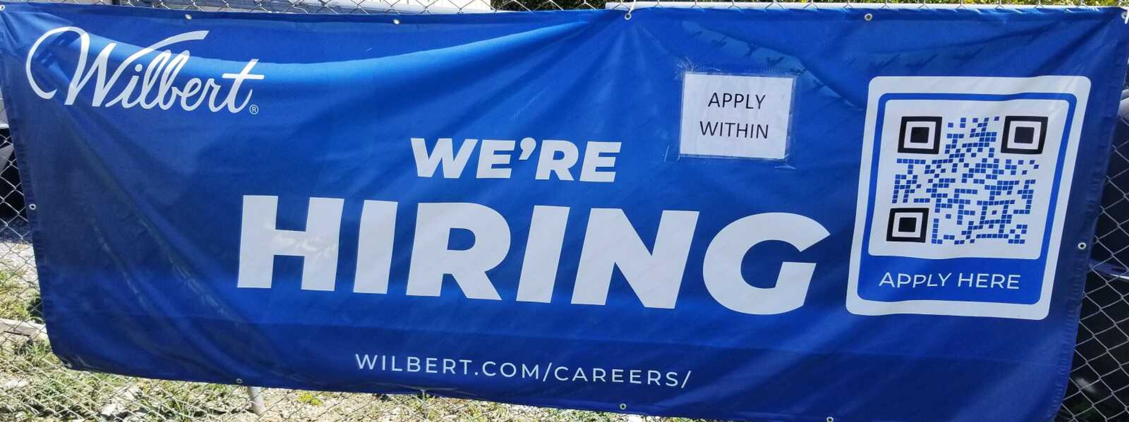 A banner advertising to fill open positions at Cape Wilbert Vault Company, 3520 Matthew St. is seen Friday in Jackson.