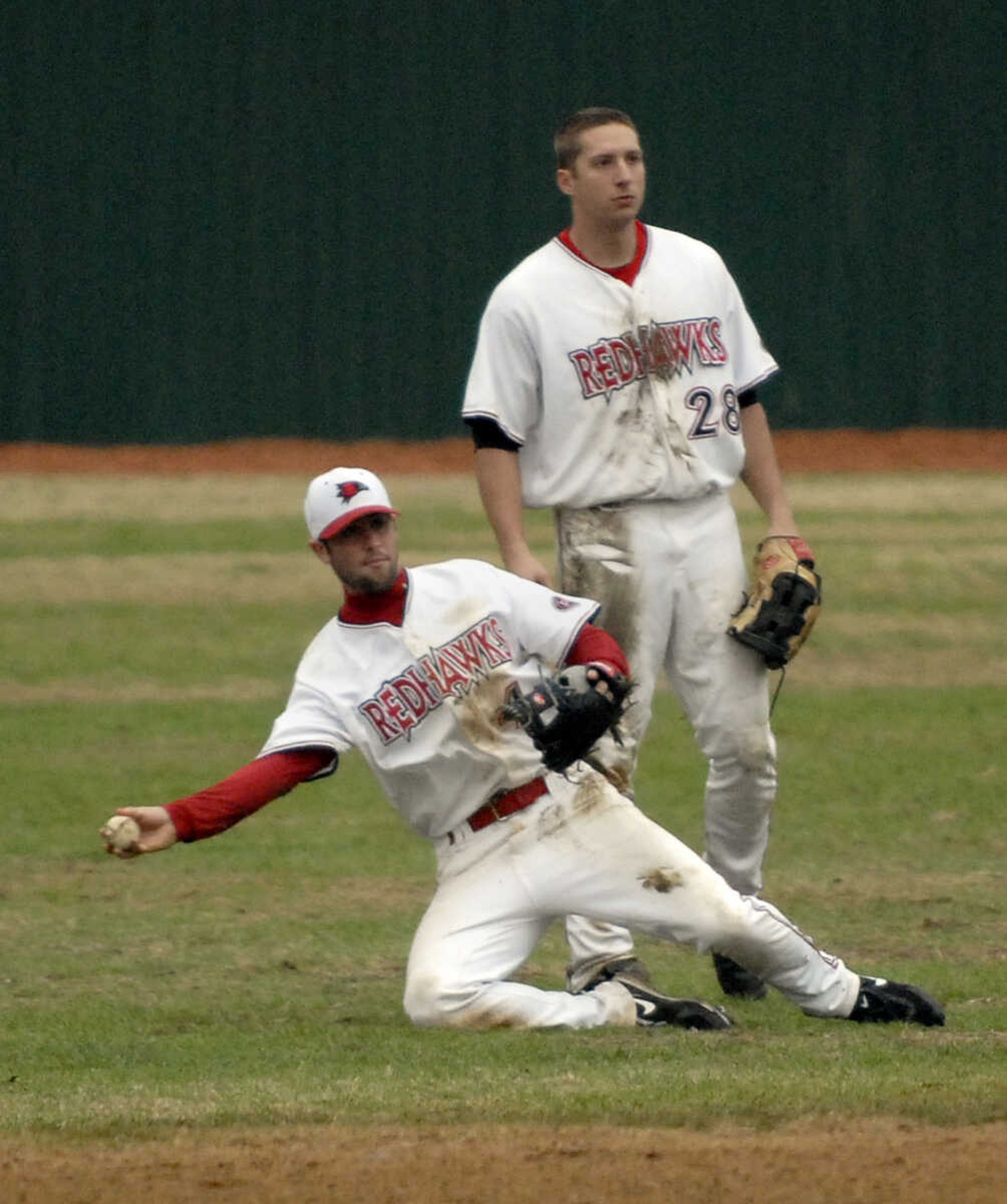 LAURA SIMON~lsimon@semissourian.com
Southeast senior Blake Slattery backs up teammate Kenton Parmley in the sixth inning against Ball State Sunday, February 27, 2011 at Capaha Field. Southeast defeated Ball State 22-8.