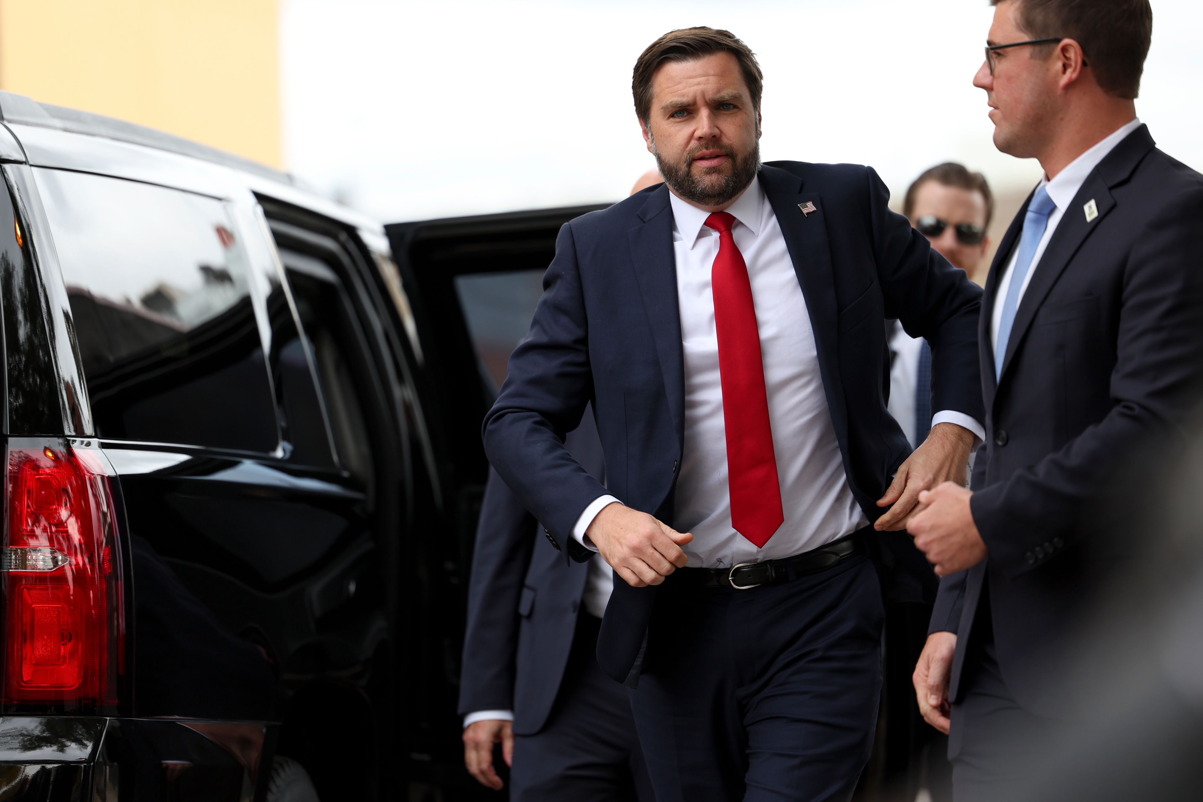 Republican vice presidential nominee Sen. JD Vance, R-Ohio, walks to speak in front of the Minneapolis police department's 3rd precinct, which was ransacked and burned after the murder of George Floyd in 2020, Monday, Oct. 14, 2024, in Minneapolis. (AP Photo/Ellen Schmidt)