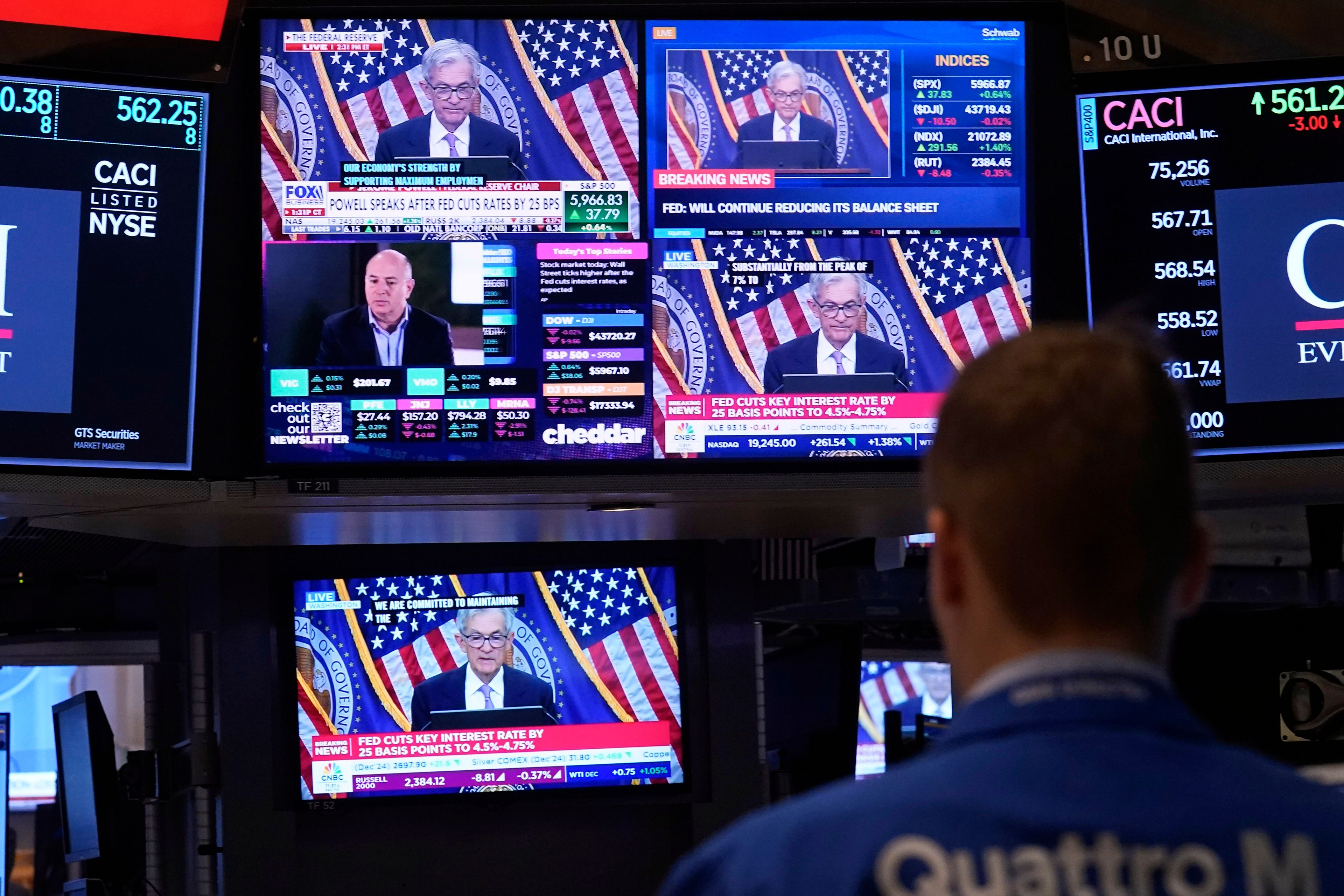 Comments by Federal Reserve Chair Jerome Powell appear on a bank of screens on the floor of the New York Stock Exchange, Thursday, Nov. 7, 2024, in New York. (AP Photo/Richard Drew)