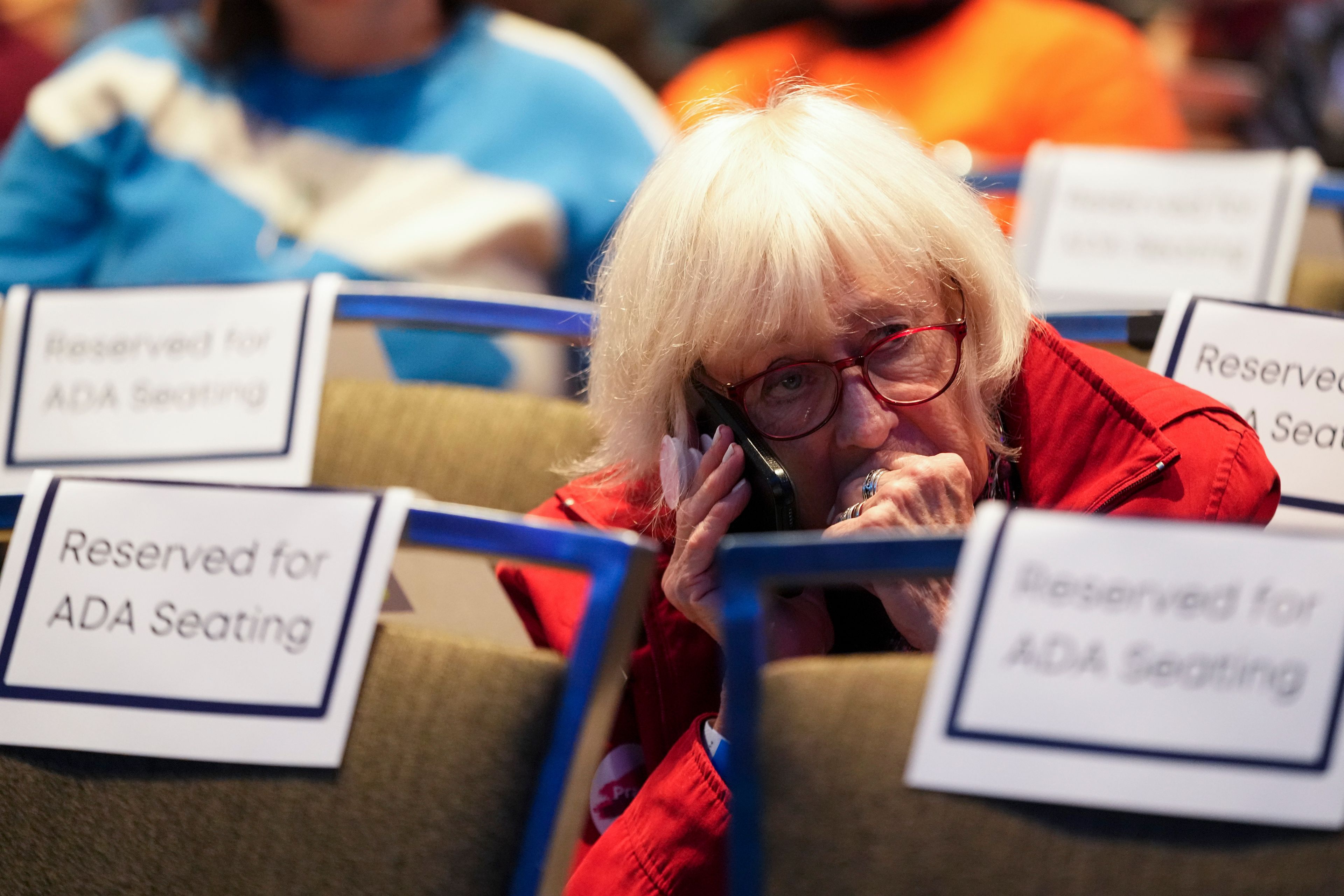 An attendee watches election results at the Washington State Democrats party on Election Day, Tuesday, Nov. 5, 2024, in Seattle. (AP Photo/Lindsey Wasson)