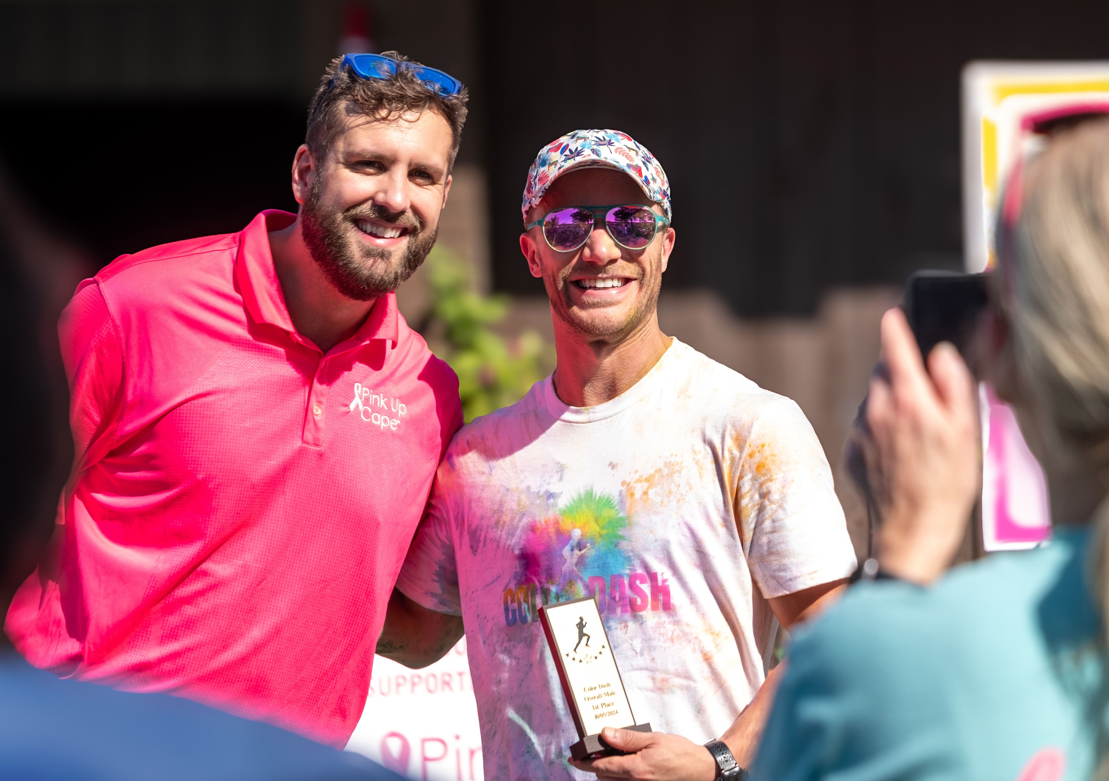 Event organizer Nate Gautier presents the first-place trophy to Stephen Schott of Cape Girardeau.
