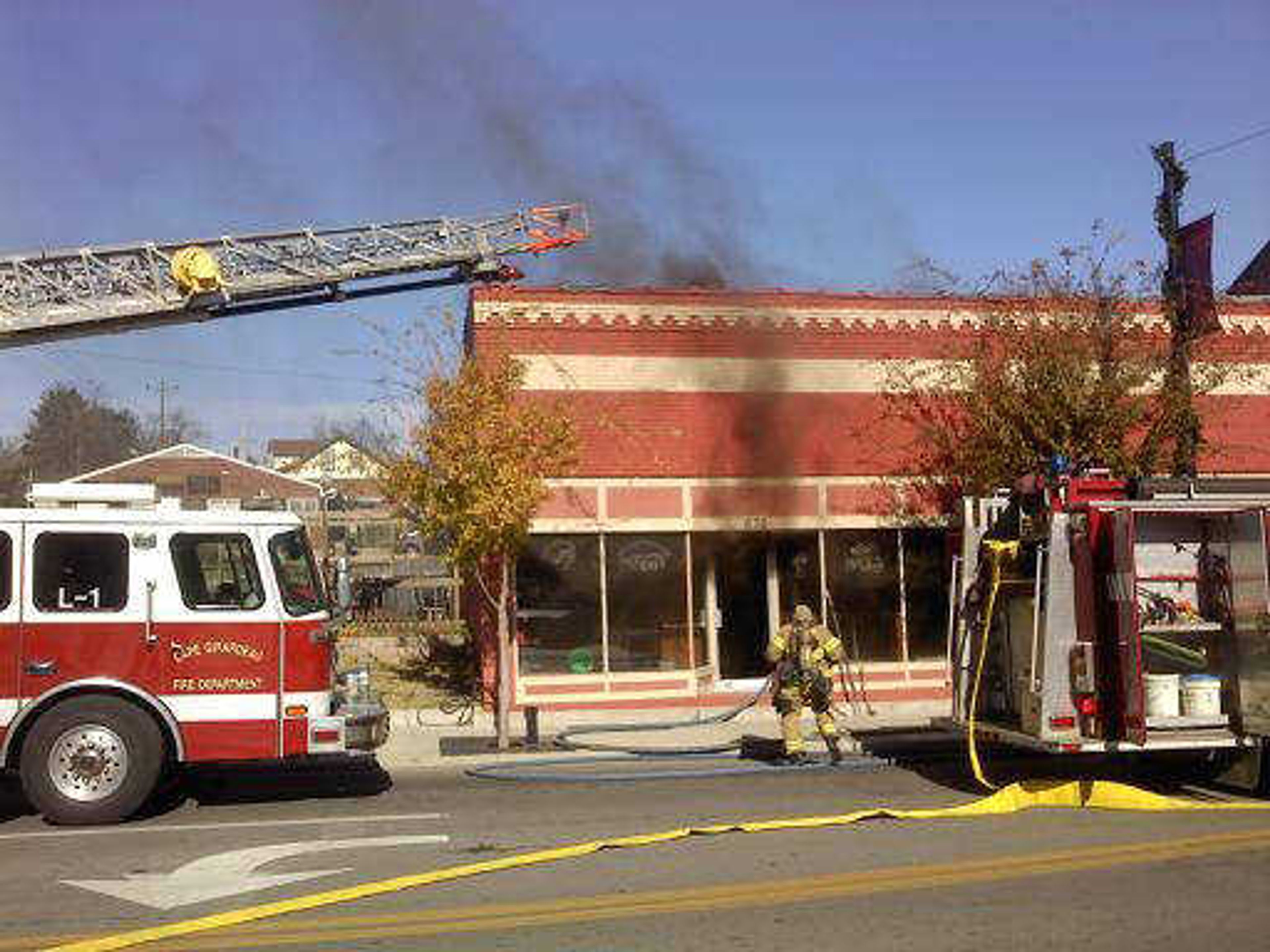 Members of the Cape Girardeau Fire Department were on the scene of a fire Friday afternoon at Last Call restaurant and bar at the corner of Broadway and Sprigg Street. (Tyler Graef)