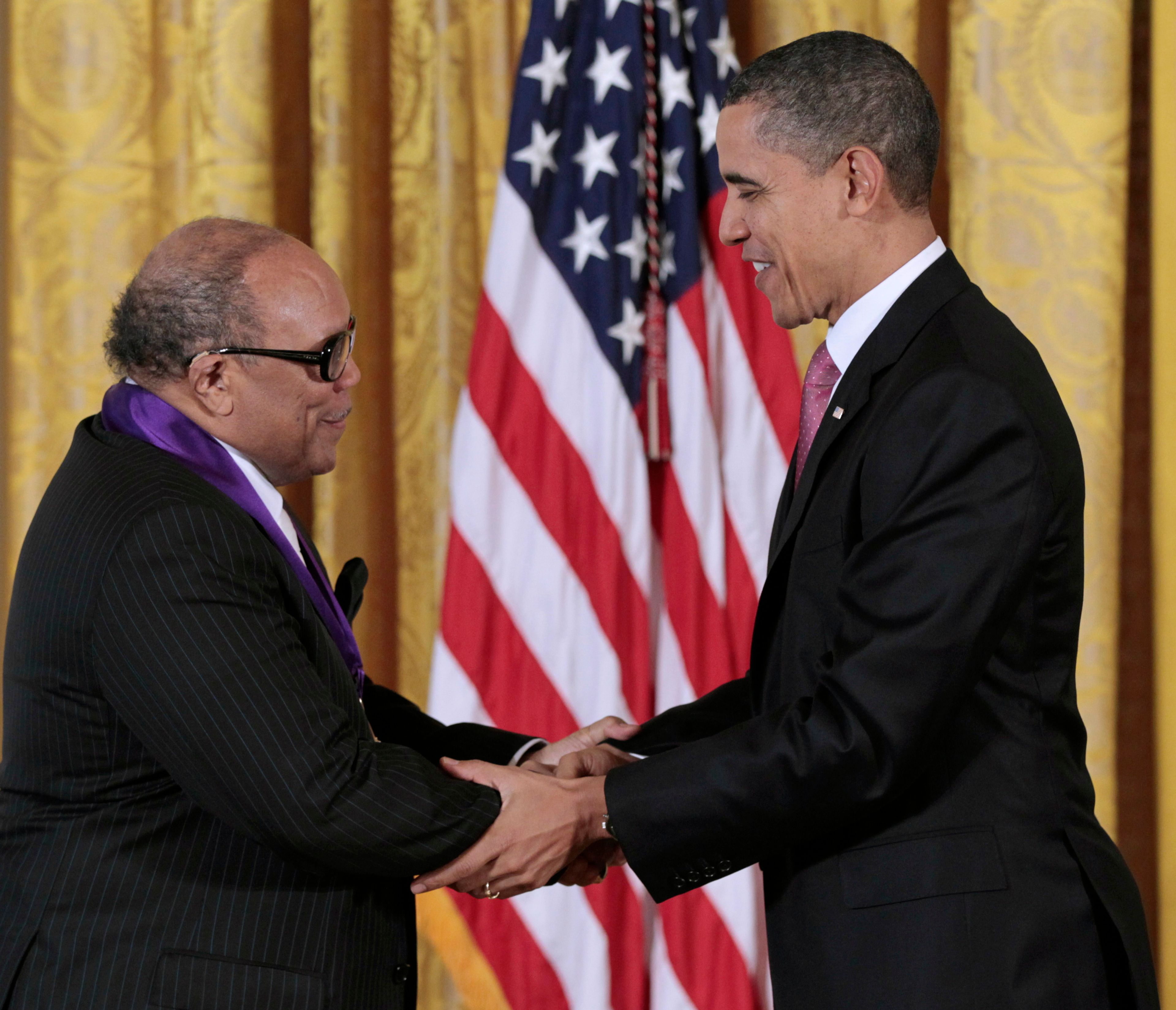 FILE - President Barack Obama presents a 2010 National Medal of Arts to musician and record producer Quincy Jones, Wednesday, March 2, 2011, during a ceremony in the East Room of the White House in Washington. Quincy Jones has died at age 91. (AP Photo/Pablo Martinez Monsivais, File)