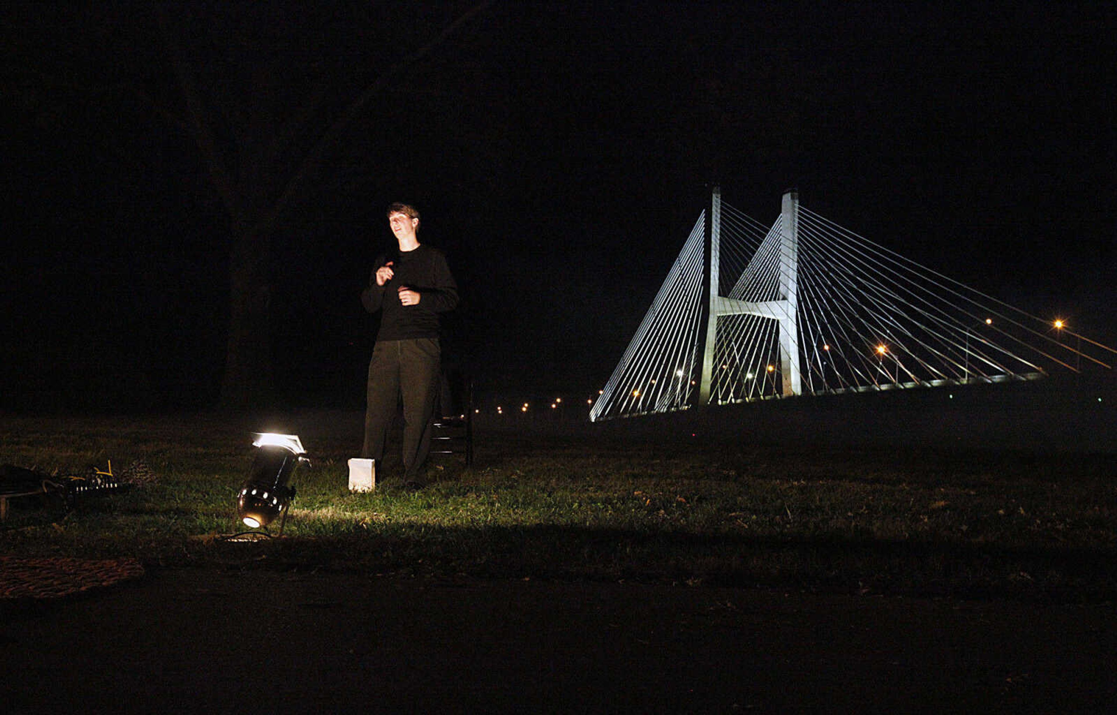 CHRIS MACKLER ~ photos@semissourian.com

Sign language interpreter Jessica Lagona signs during the Ghost Storytelling Festival held near the Old Beech Tree on the east lawn of Southeast Missouri State University's River Campus in Cape Girardeau on Friday, Oct. 15, 2010. According to Chuck Martin, Executive Director of the Cape Girardeau Convention and Visitors Bureau, around 650 people attended the event.