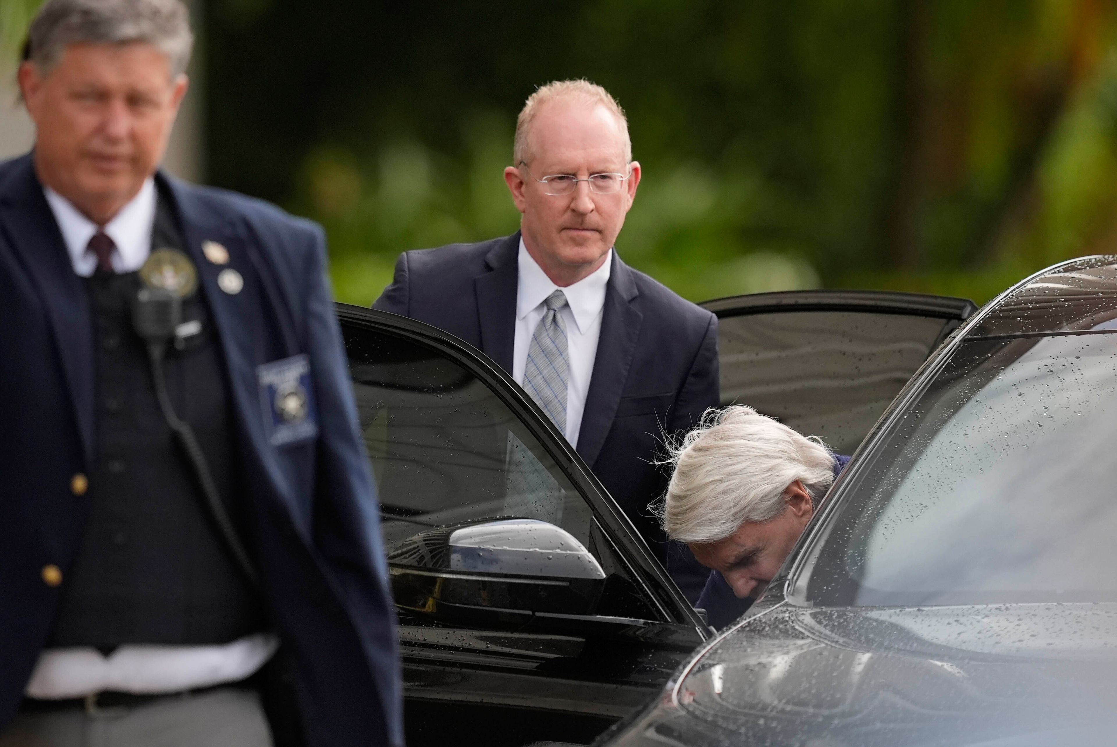 Michael Jeffries, right, former CEO of Abercrombie & Fitch, gets into the car of his attorney, Brian Bieber, center, as they leave following a hearing at the Paul G. Rogers Federal Building and U.S. Courthouse, in West Palm Beach, Fla., Tuesday, Oct. 22, 2024. (AP Photo/Rebecca Blackwell)