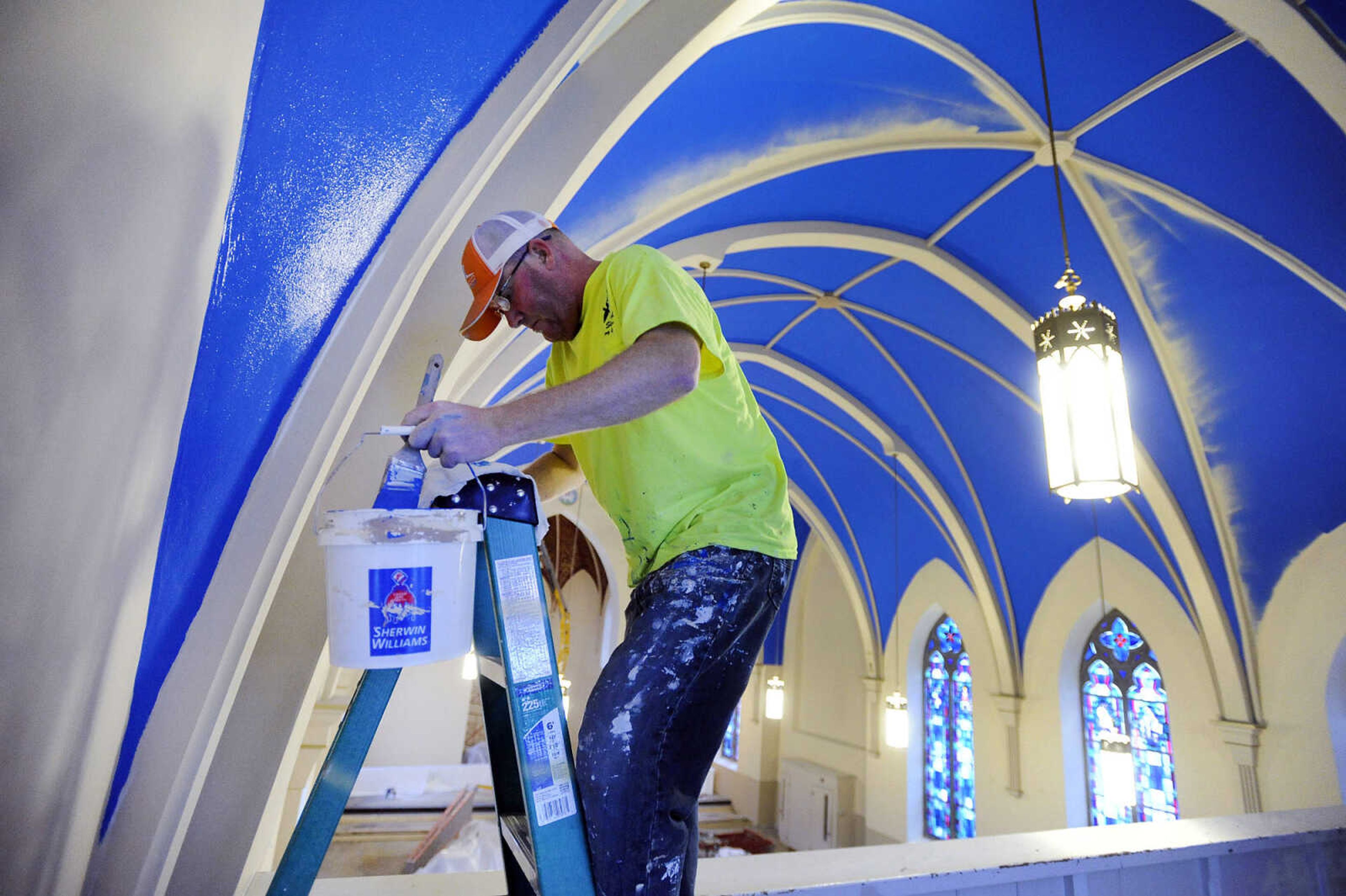 LAURA SIMON ~ lsimon@semissourian.com

Brad Earnhardt paints the ceiling surrounding the choir loft at St. John's Catholic Church in Leopold, Missouri on March 4, 2016.