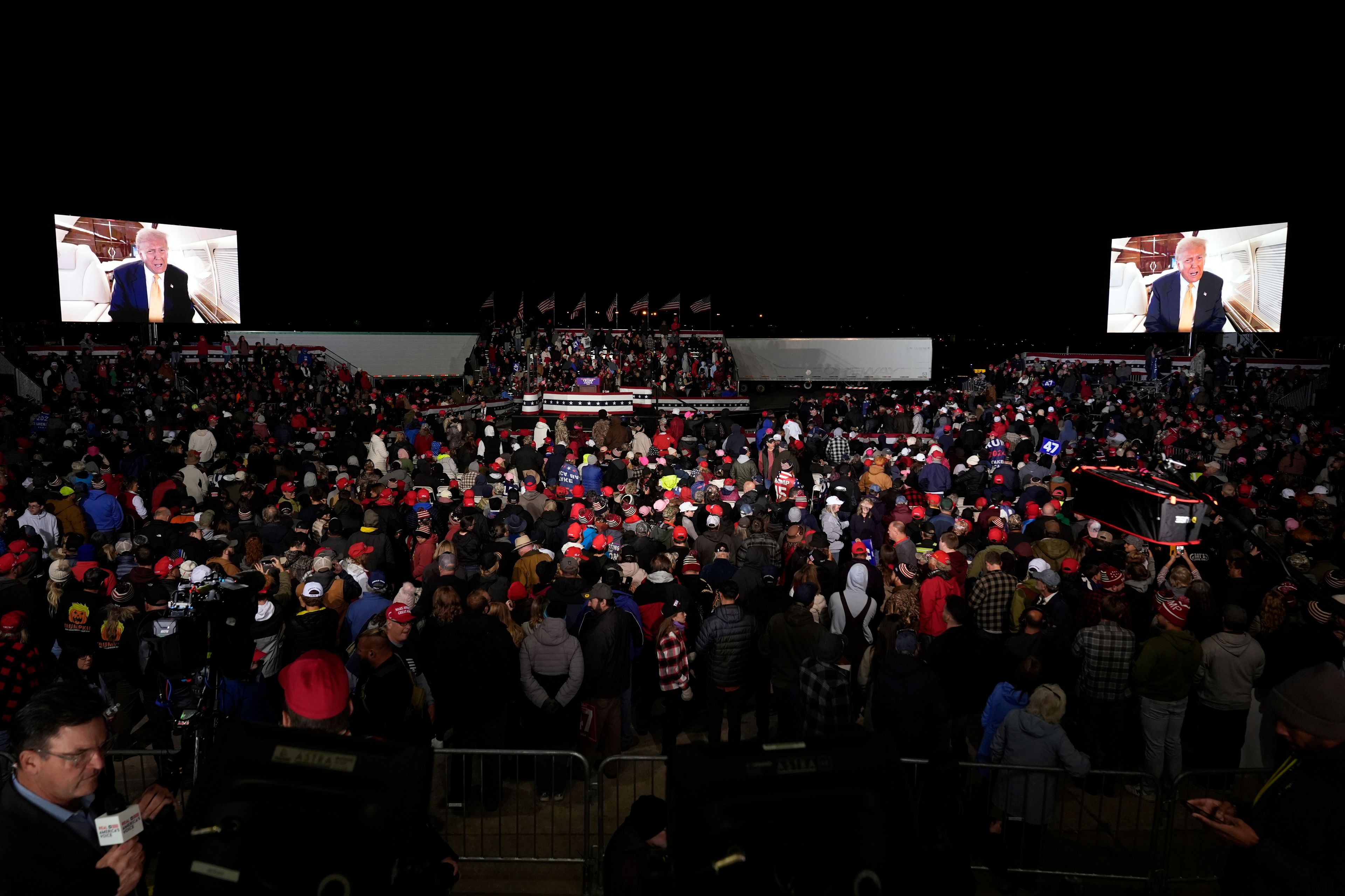 A video message from Republican presidential nominee former President Donald Trump is played at a campaign event Friday, Oct. 25, 2024, in Traverse City, Mich. (AP Photo/Paul Sancya)