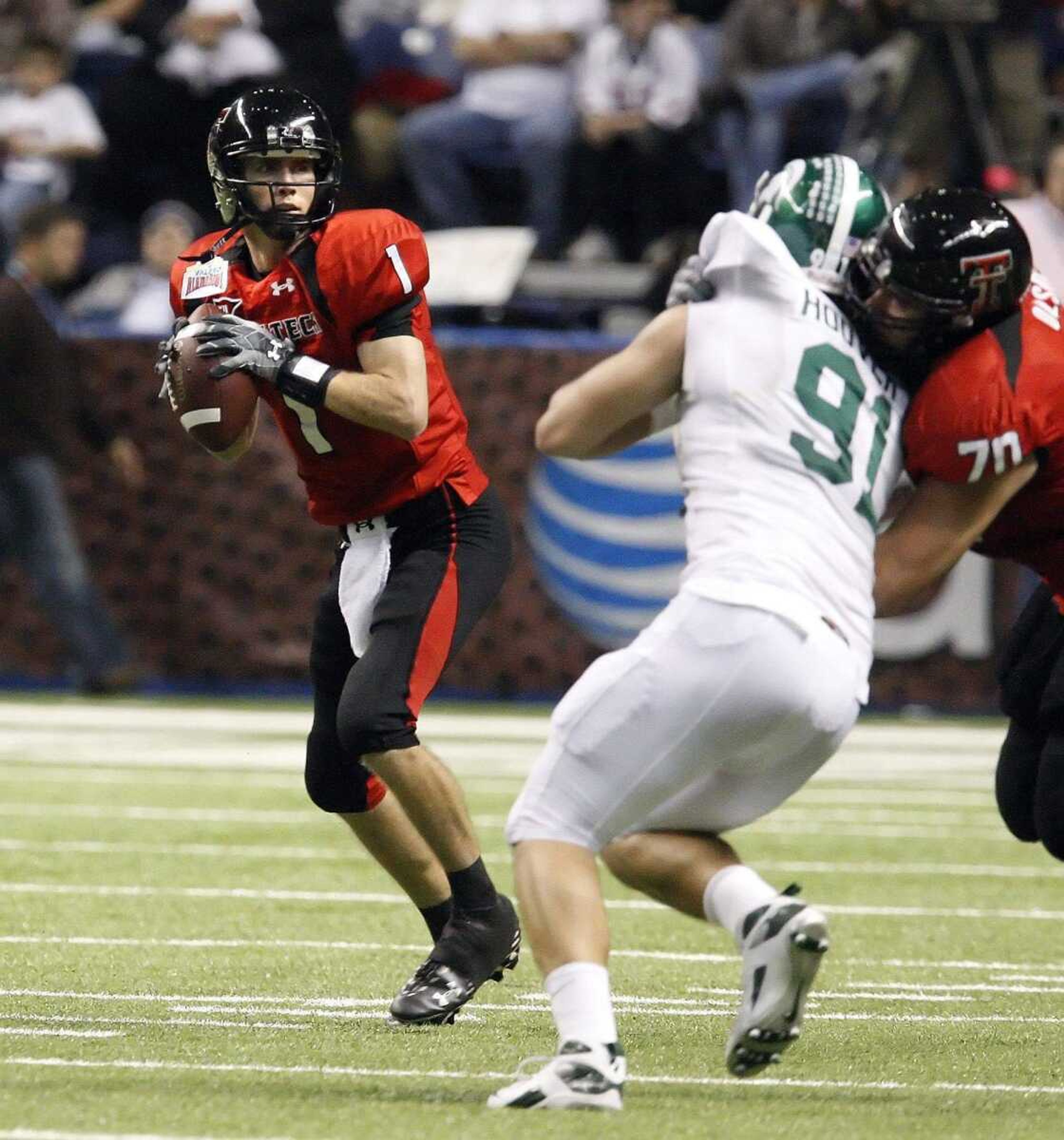 Texas Tech backup quarterback Steven Sheffield (1) drops back for a pass against Michigan State during the fourth quarter of the Alamo Bowl NCAA football game in San Antonio, Saturday, Jan. 2, 2010. (AP Photo/Kin Man Hui/San Antonio Express-News)